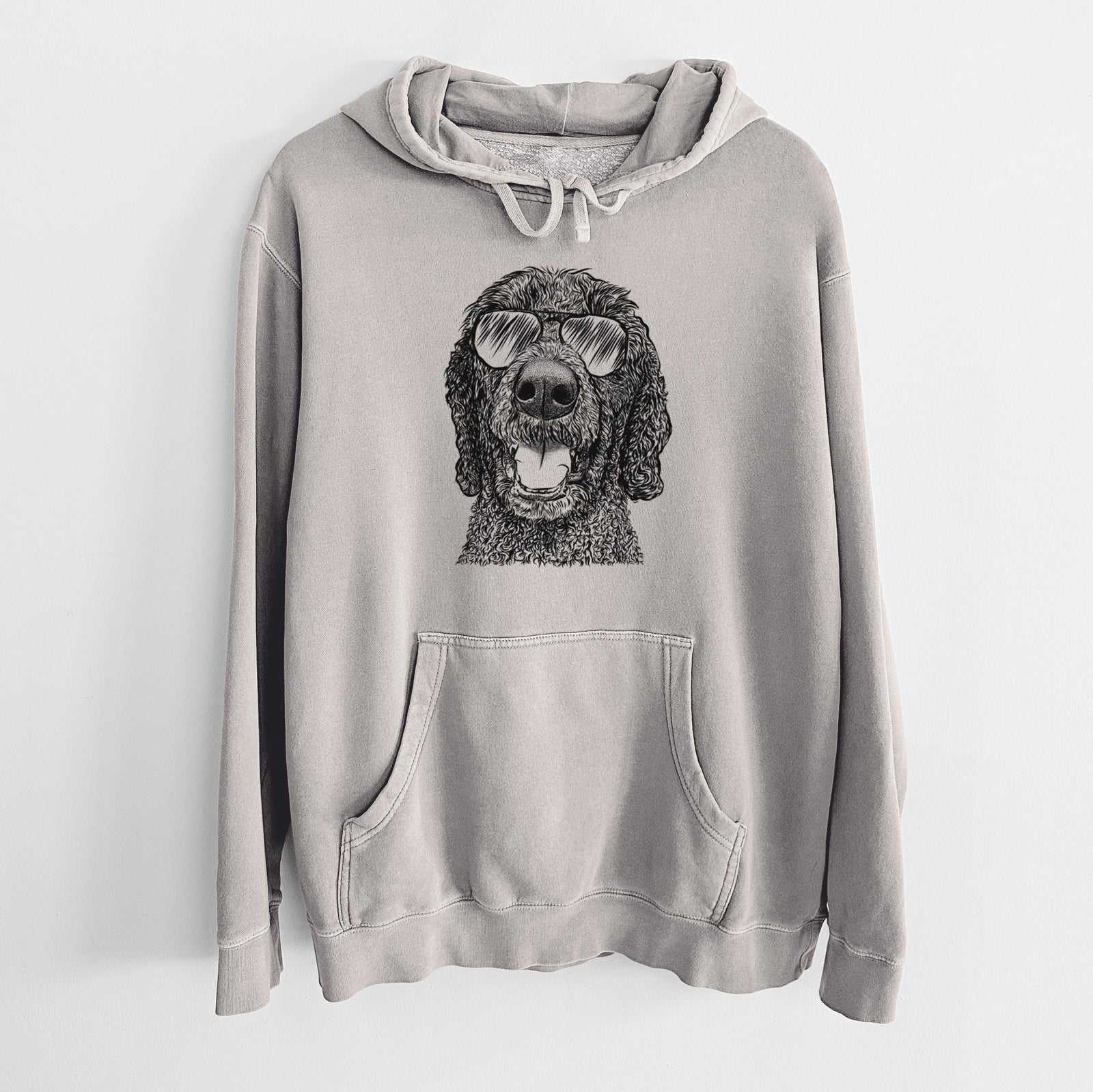 Hand-drawn sketch of Obi James the Goldendoodle wearing aviator sunglasses on a Cement Unisex pigment dyed hoodie