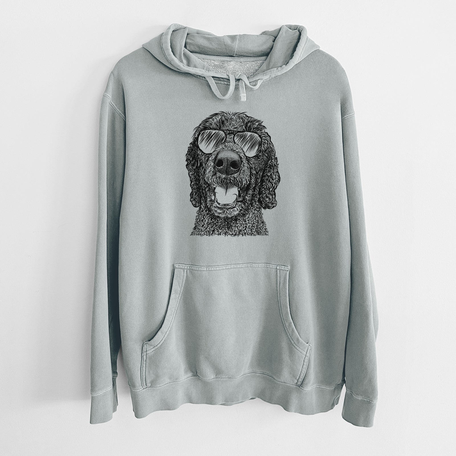 Hand-drawn sketch of Obi James the Goldendoodle wearing aviator sunglasses on a Sage Unisex pigment dyed hoodie