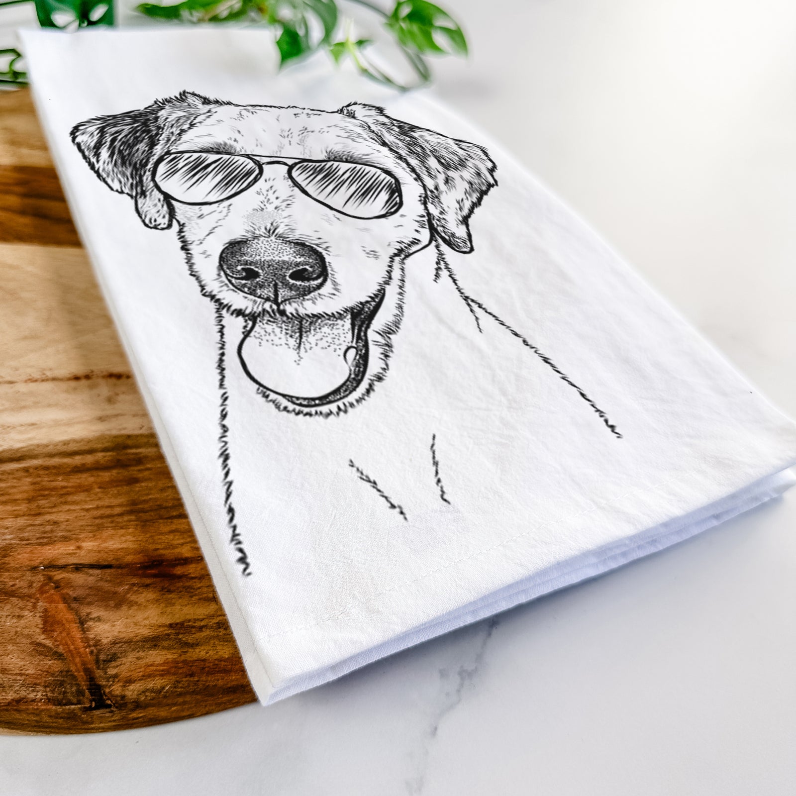 Hand-drawn sketch of Palm Palm the Aussiedoodle wearing aviator sunglasses on a tea towel