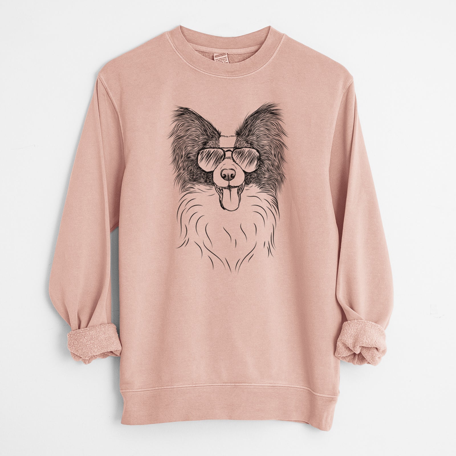 Hand-drawn sketch of Patrick the Papillon wearing aviator sunglasses on a Dusty Pink Unisex pigment dyed crew sweatshirt