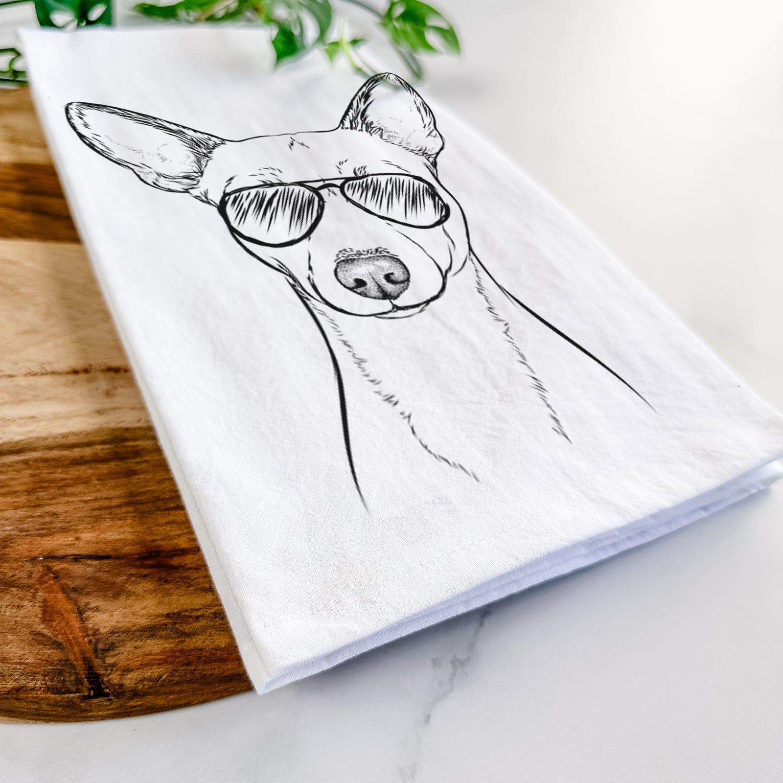 Hand-drawn sketch of Perry the Portuguese Podengo wearing aviator sunglasses on a tea towel