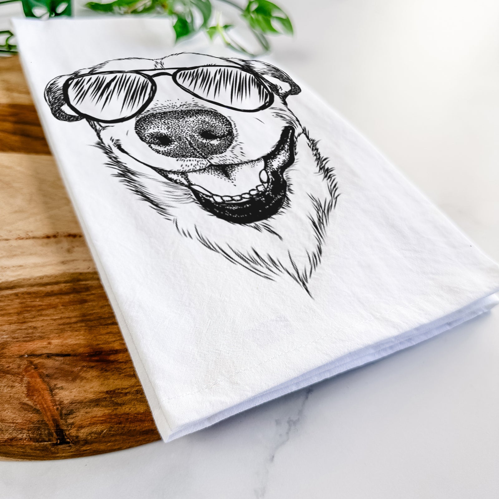Hand-drawn sketch of Petrah the Staffy Mix wearing aviator sunglasses on a tea towel