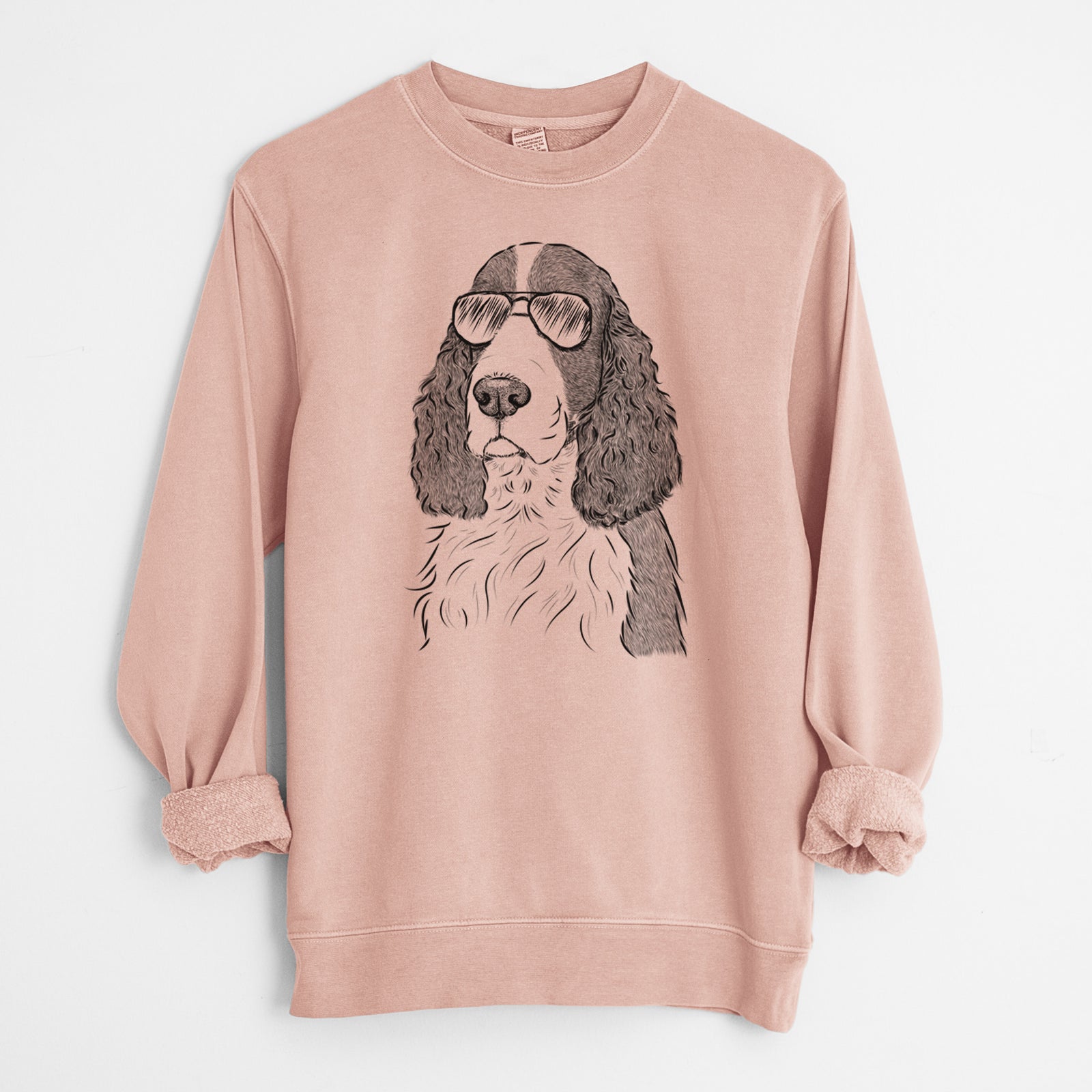 Hand-drawn sketch of Quincy the English Springer Spaniel wearing aviator sunglasses on a Dusty Pink Unisex pigment dyed crew sweatshirt