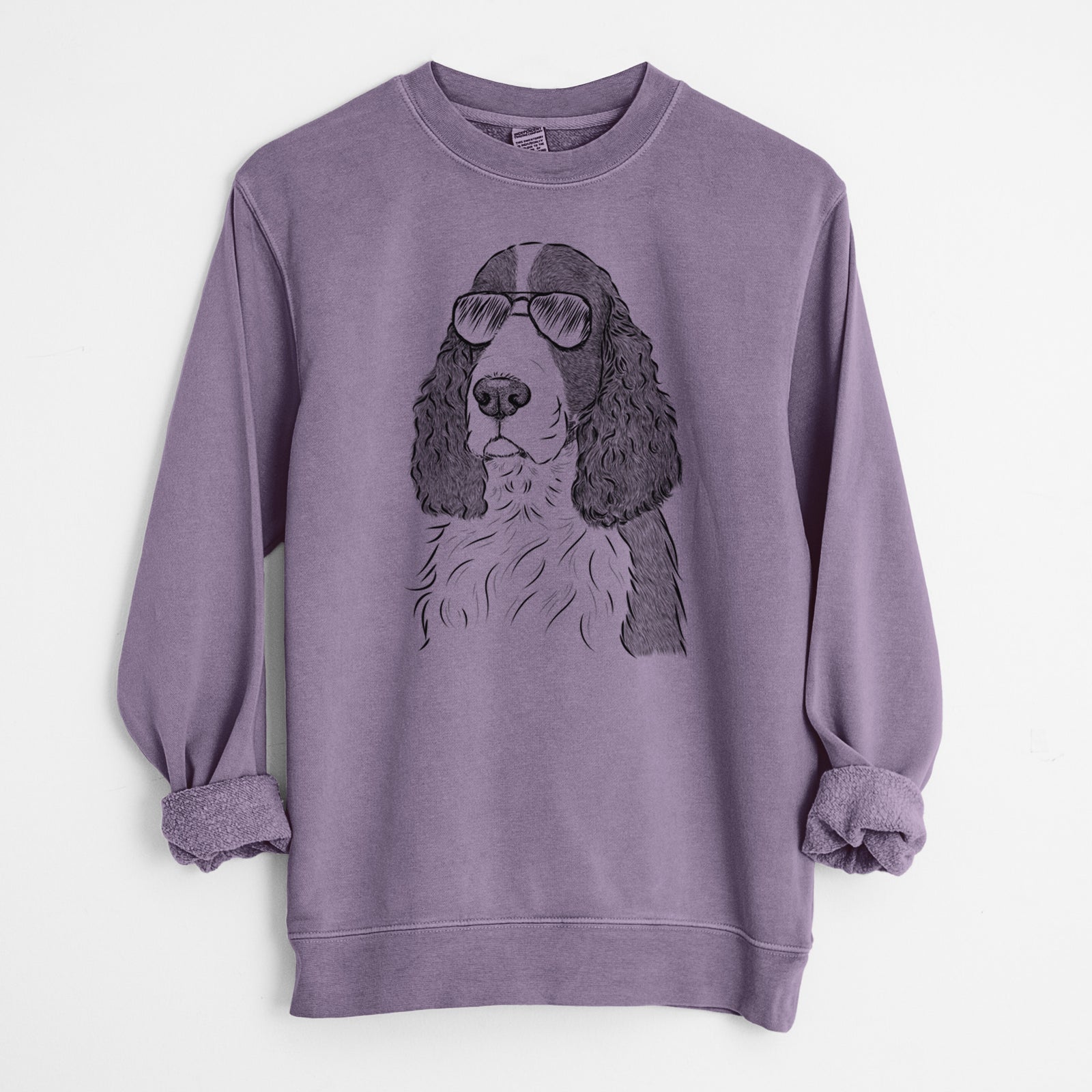 Hand-drawn sketch of Quincy the English Springer Spaniel wearing aviator sunglasses on a Plum Unisex pigment dyed crew sweatshirt
