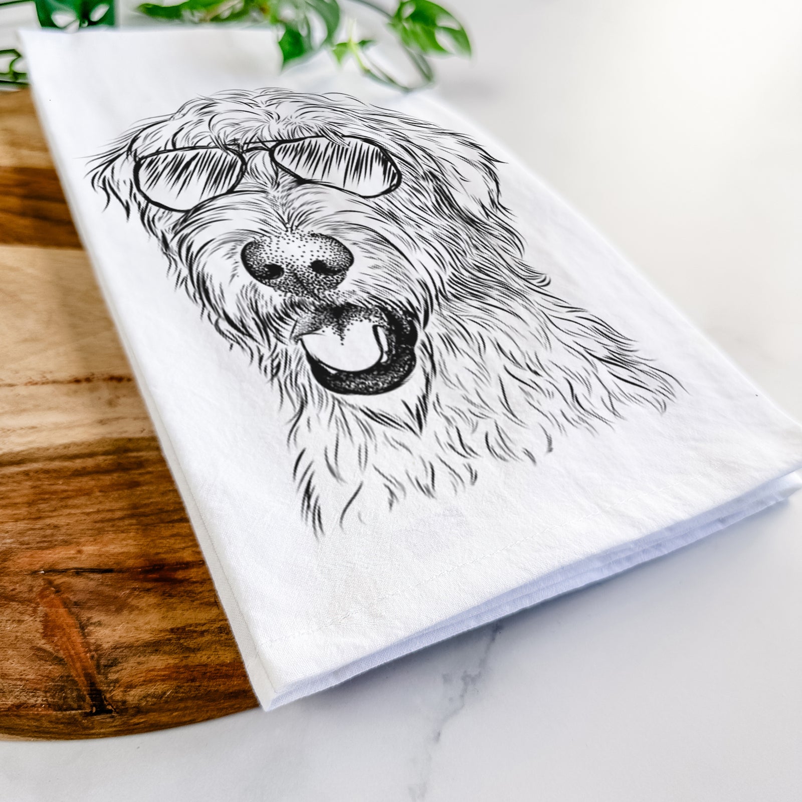 Hand-drawn sketch of Ragnar the Irish Wolfhound wearing aviator sunglasses on a tea towel