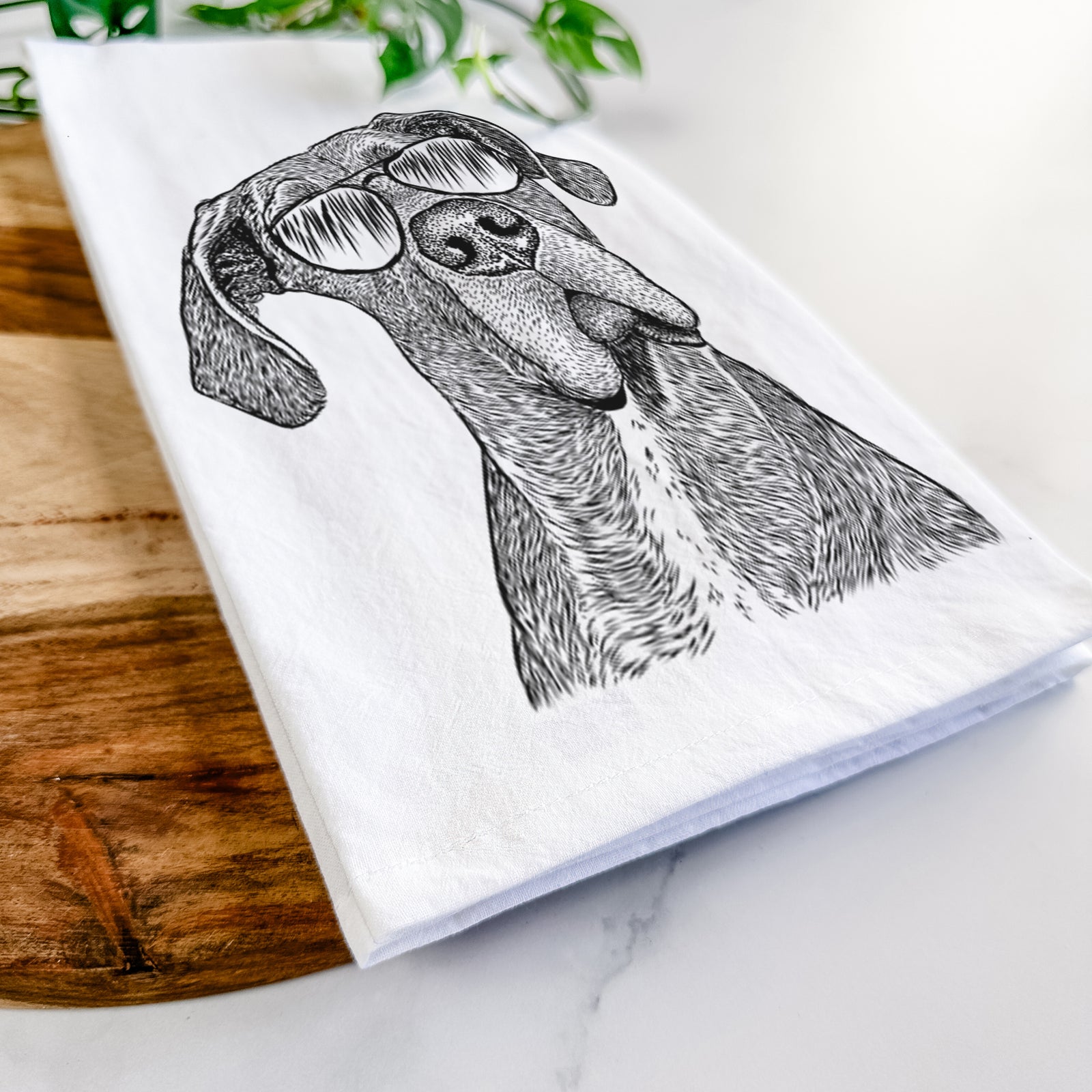 Hand-drawn sketch of River the Great Dane wearing aviator sunglasses on a tea towel