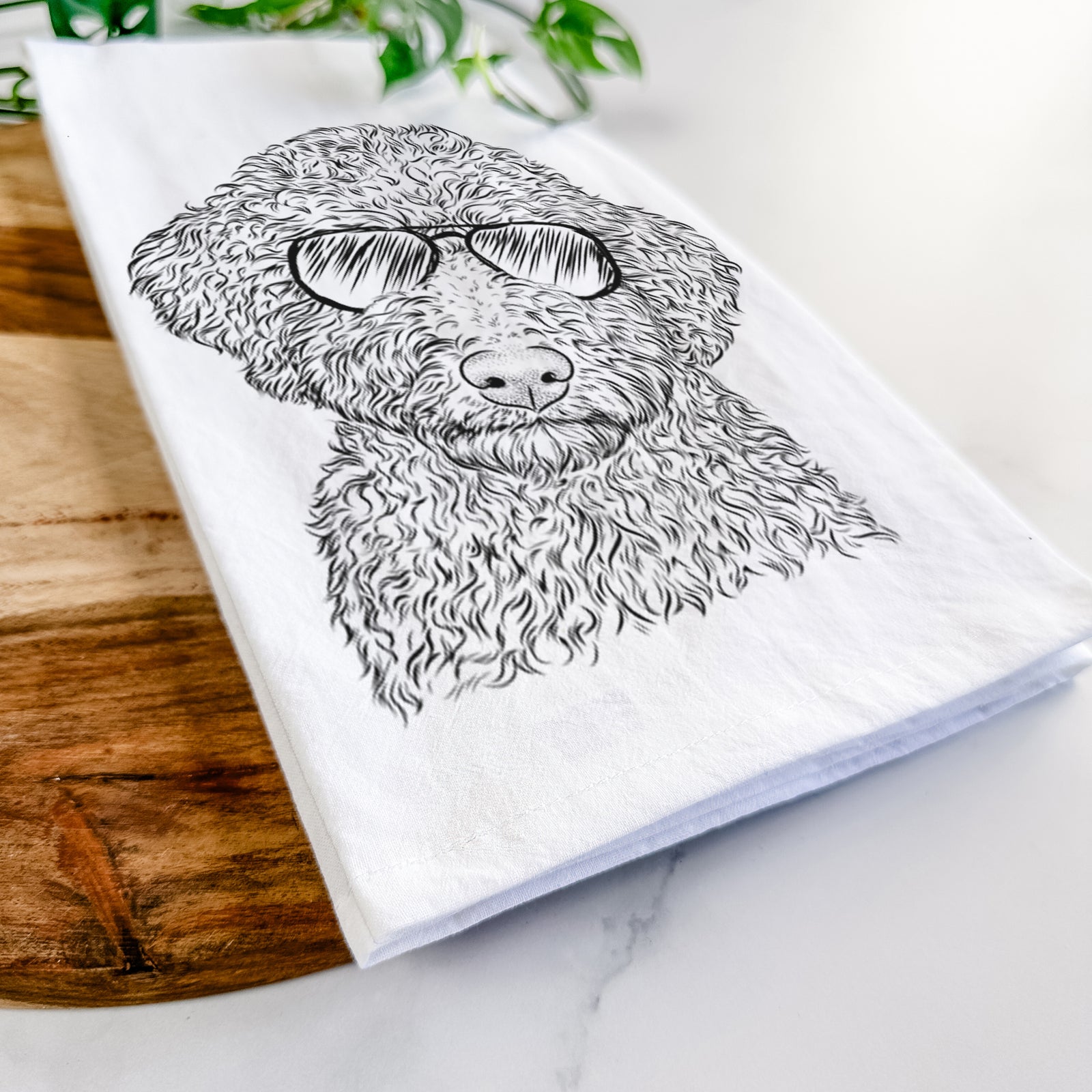 Hand-drawn sketch of Ross the Lagotto Romagnolo wearing aviator sunglasses on a tea towel