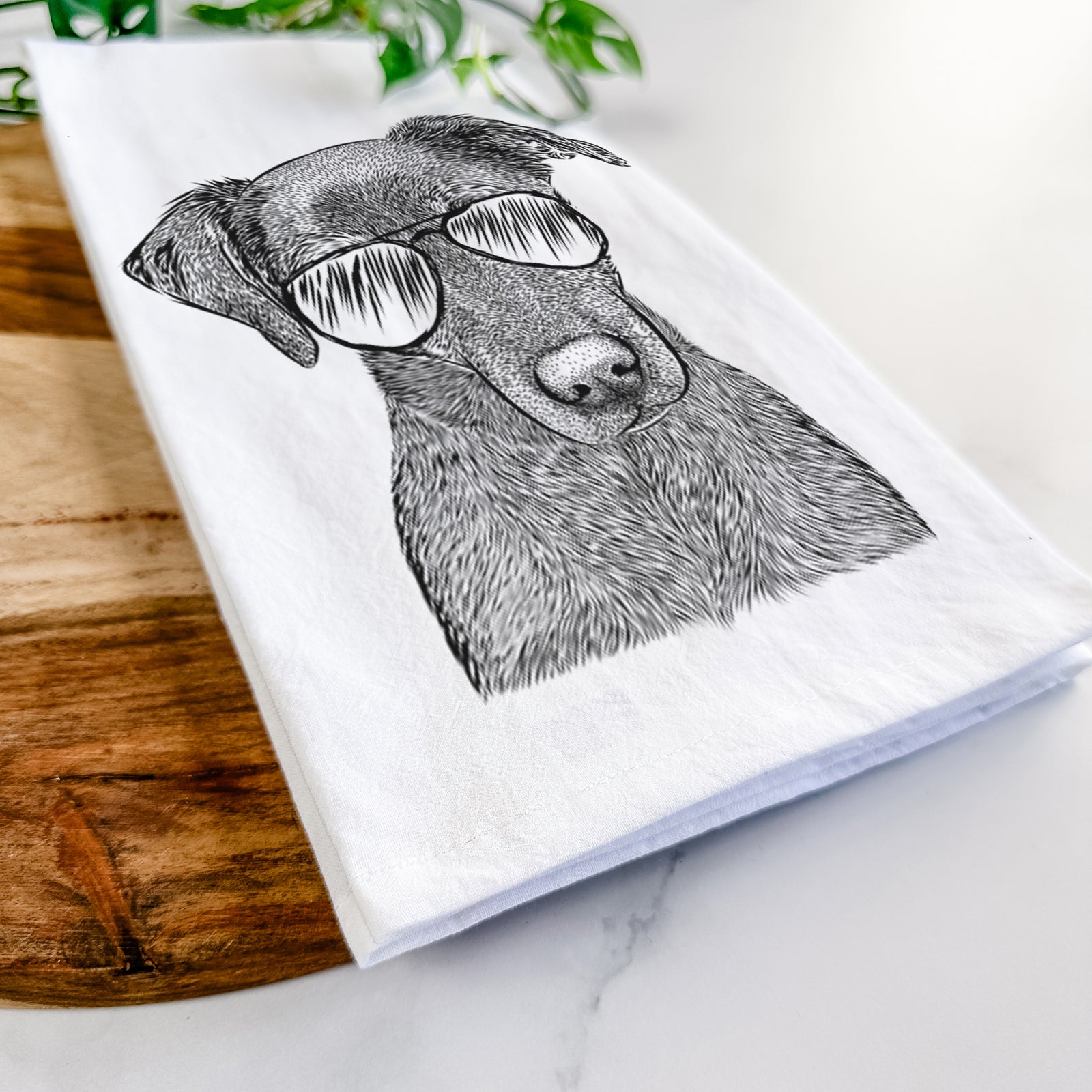 Hand-drawn sketch of Sadie the Whipador wearing aviator sunglasses on a tea towel
