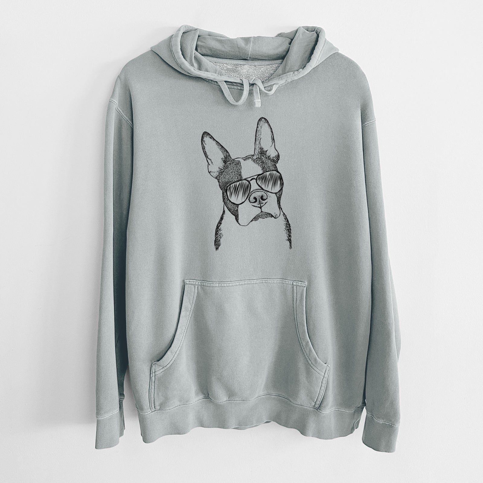 Hand-drawn sketch of Samuel the Boston Terrier wearing aviator sunglasses on a Sage Unisex pigment dyed hoodie