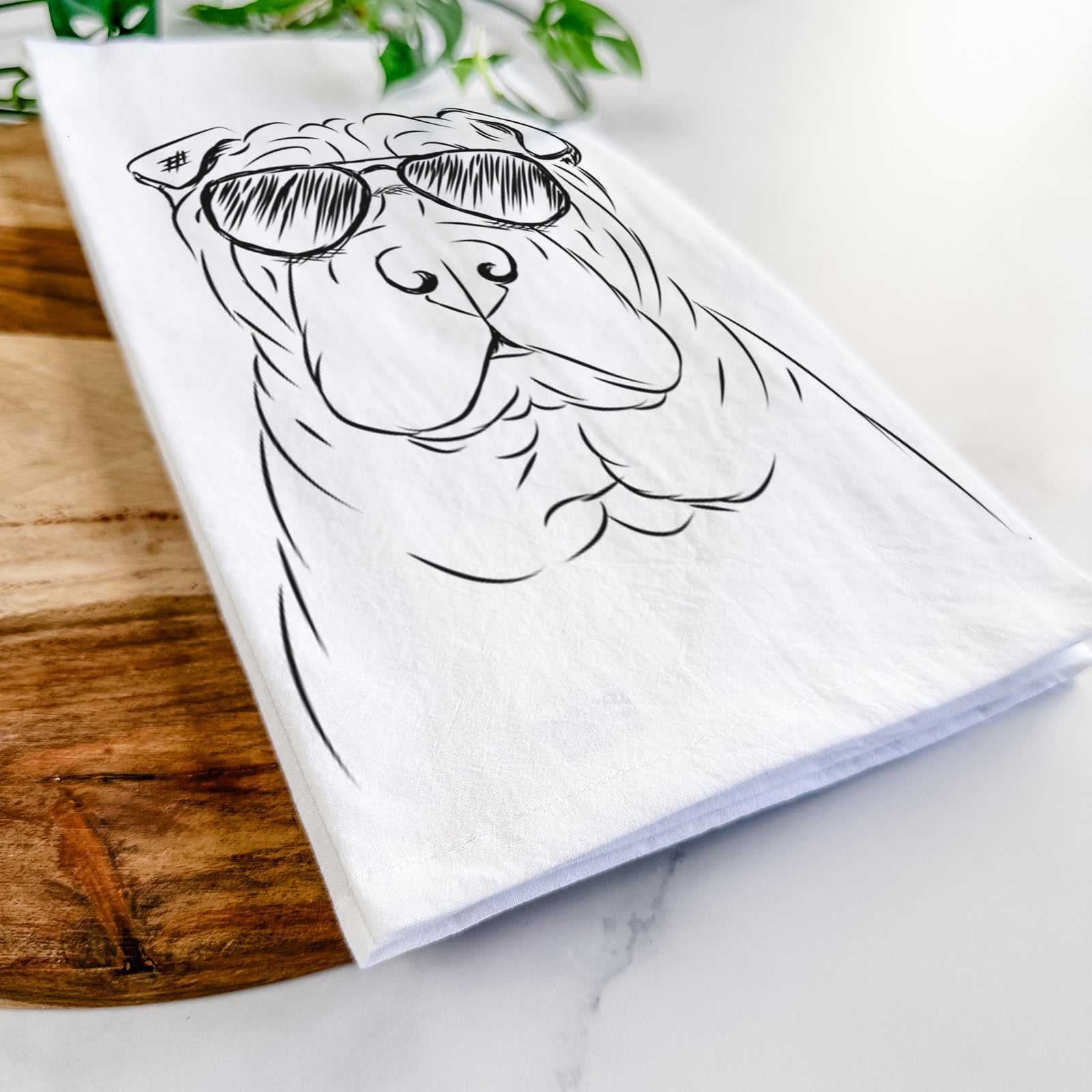 Hand-drawn sketch of Sharpy the Shar Pei wearing aviator sunglasses on a tea towel