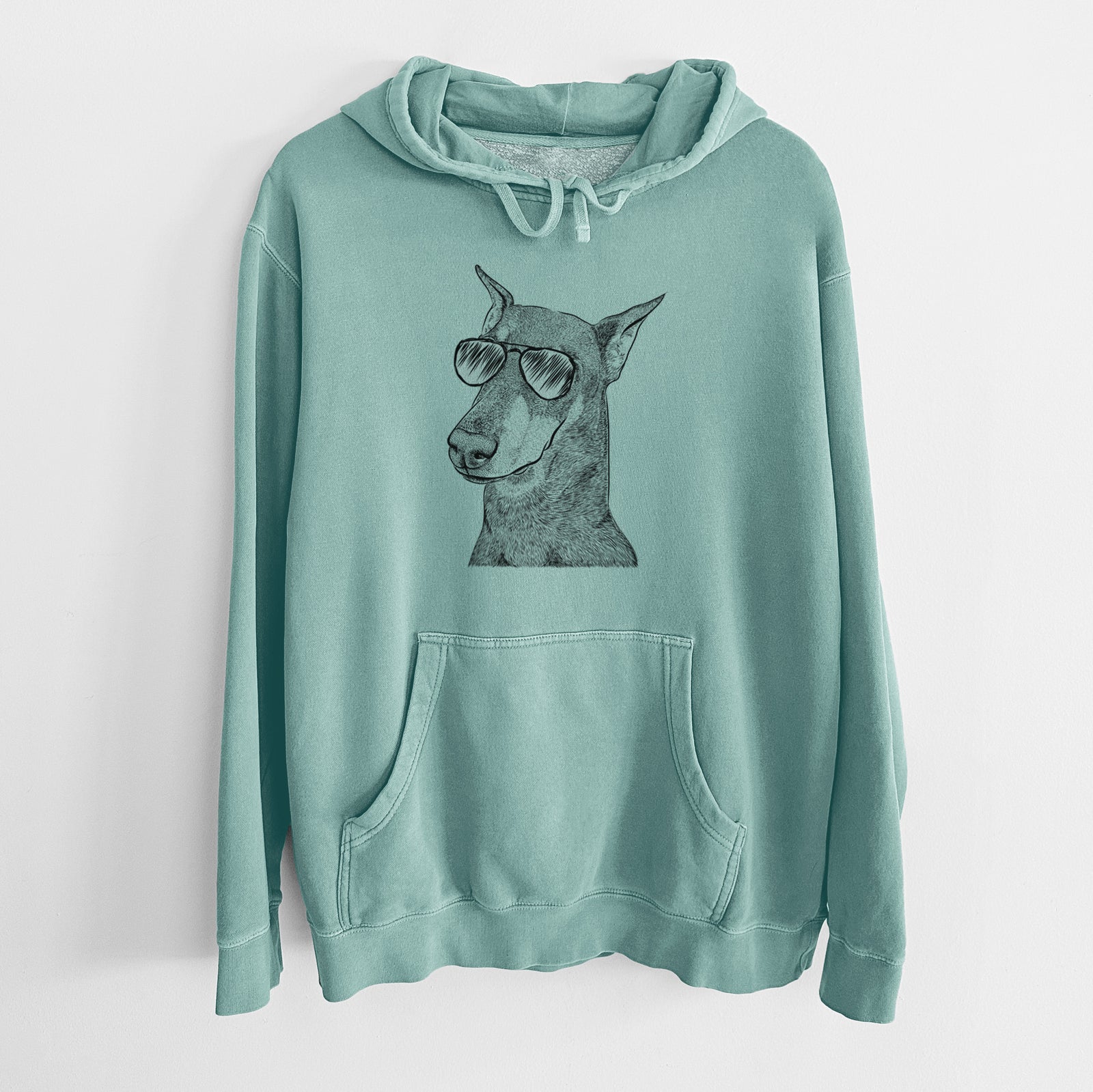 Hand-drawn sketch of Shelby the Doberman Pinscher wearing aviator sunglasses on a Mint Unisex pigment dyed hoodie