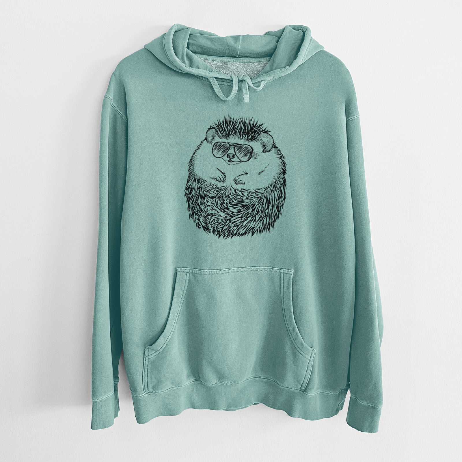 Hand-drawn sketch of Sid the Hedgehog wearing aviator sunglasses on a Mint Unisex pigment dyed hoodie