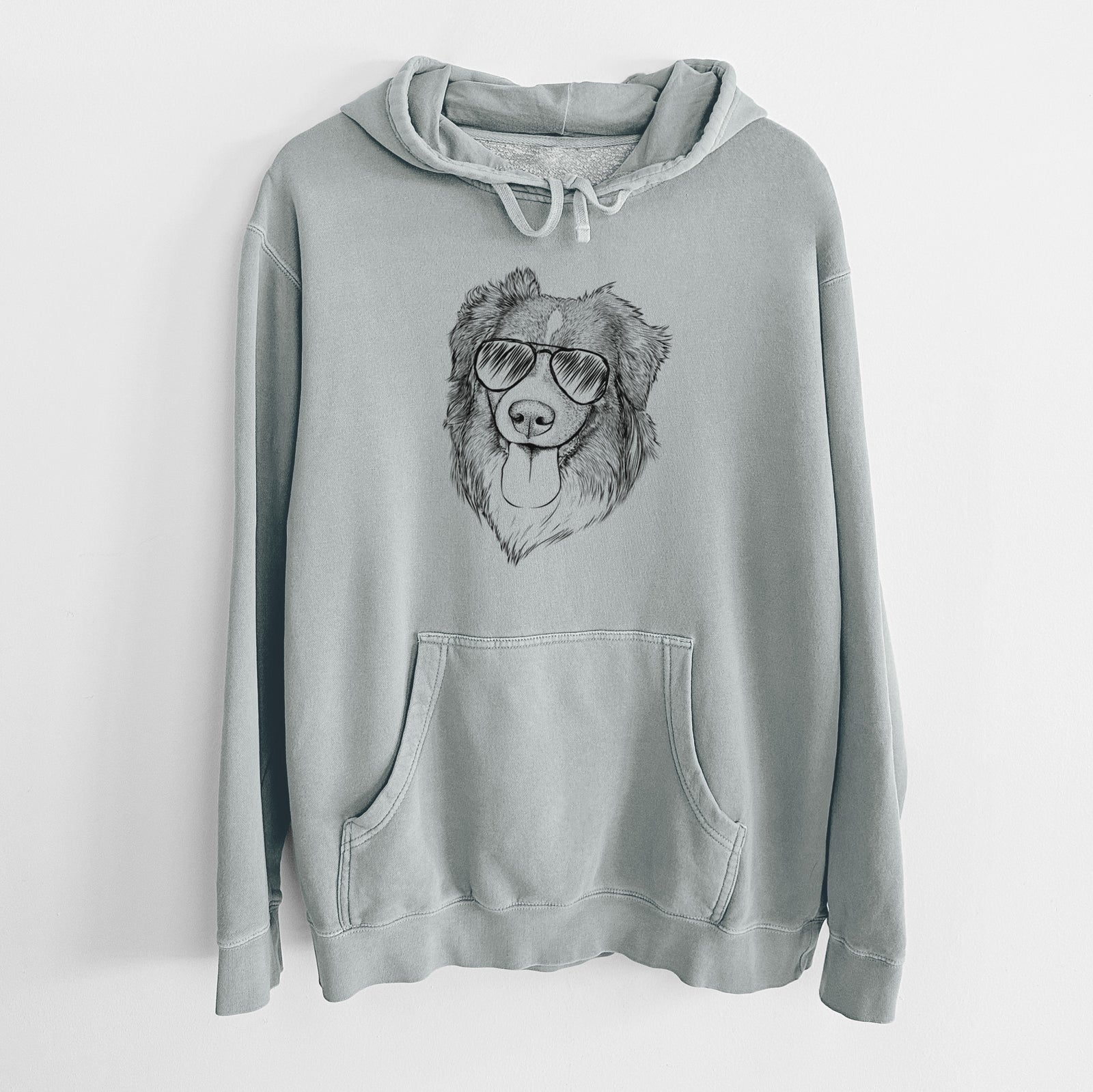 Hand-drawn sketch of Siena the Australian Shepherd wearing aviator sunglasses on a Sage Unisex pigment dyed hoodie