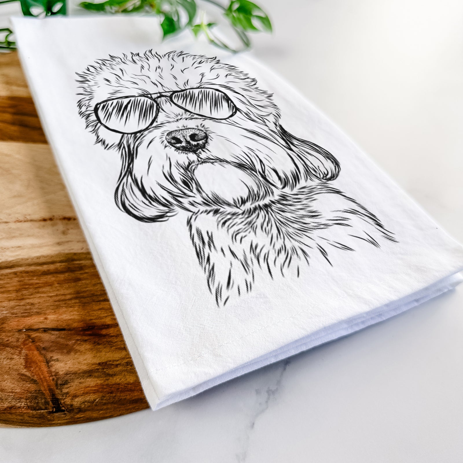 Hand-drawn sketch of Sir Walter the Dandie Dinmont Terrier wearing aviator sunglasses on a tea towel
