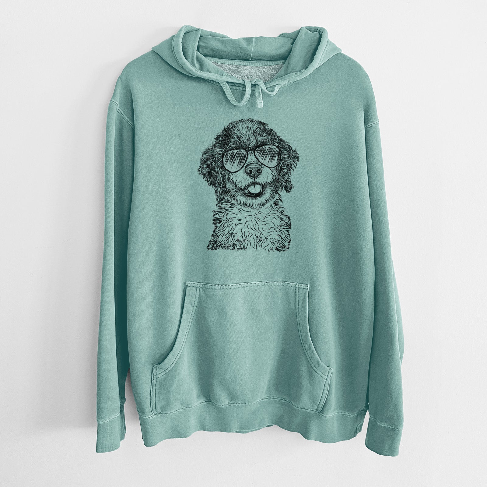 Hand-drawn sketch of Smoky the Bernedoodle Puppy wearing aviator sunglasses on a Mint Unisex pigment dyed hoodie