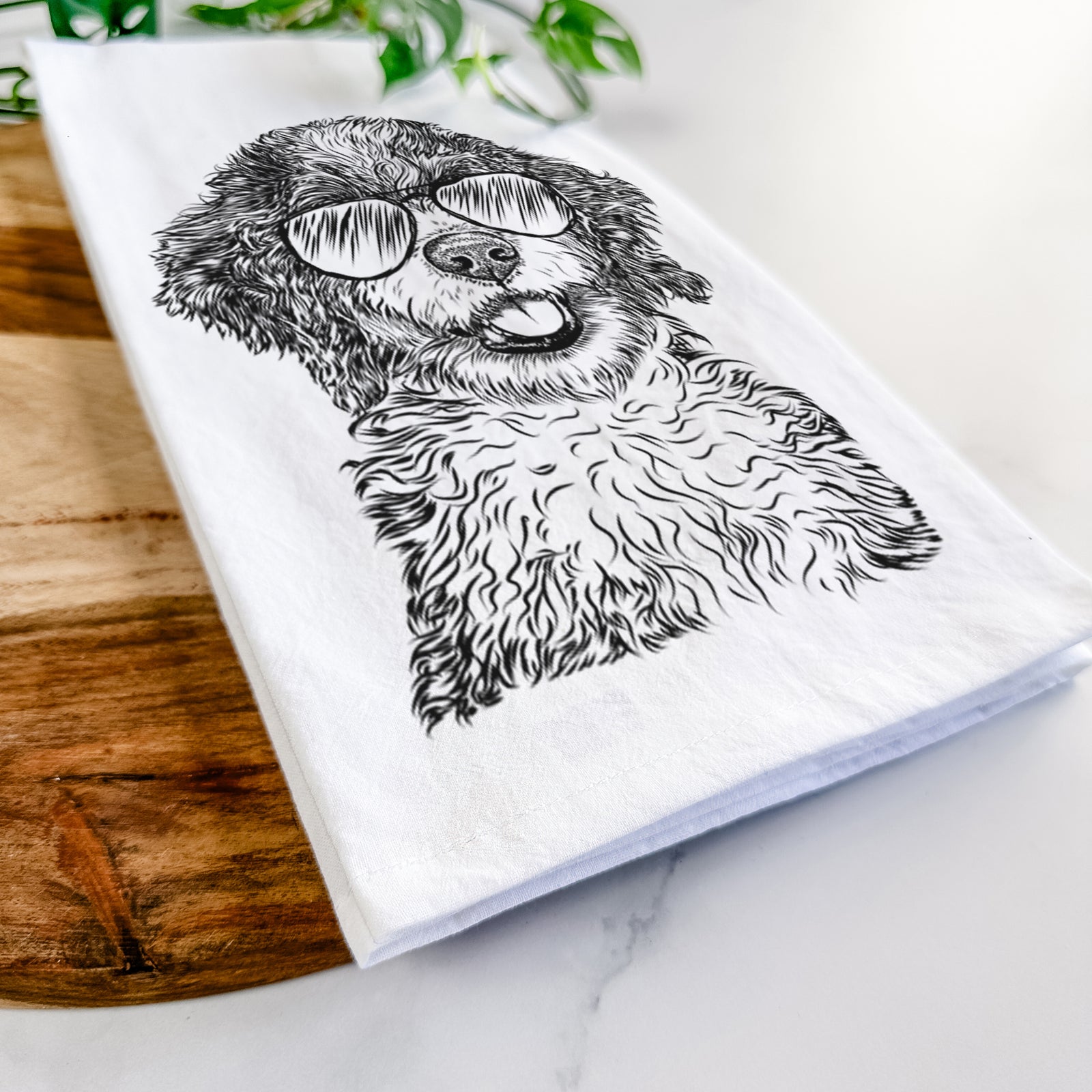 Hand-drawn sketch of Smoky the Bernedoodle Puppy wearing aviator sunglasses on a tea towel
