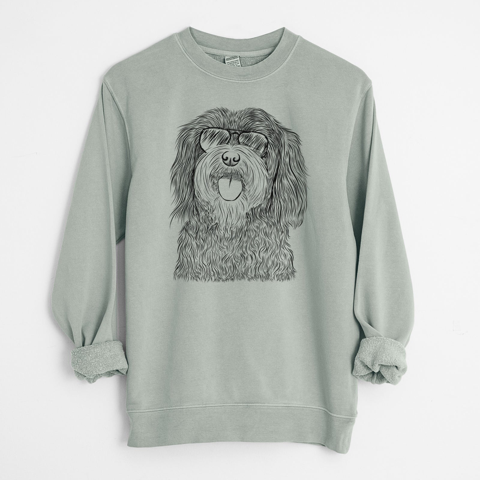 Hand-drawn sketch of Sophie the Havanese wearing aviator sunglasses on a Sage Unisex pigment dyed crew sweatshirt