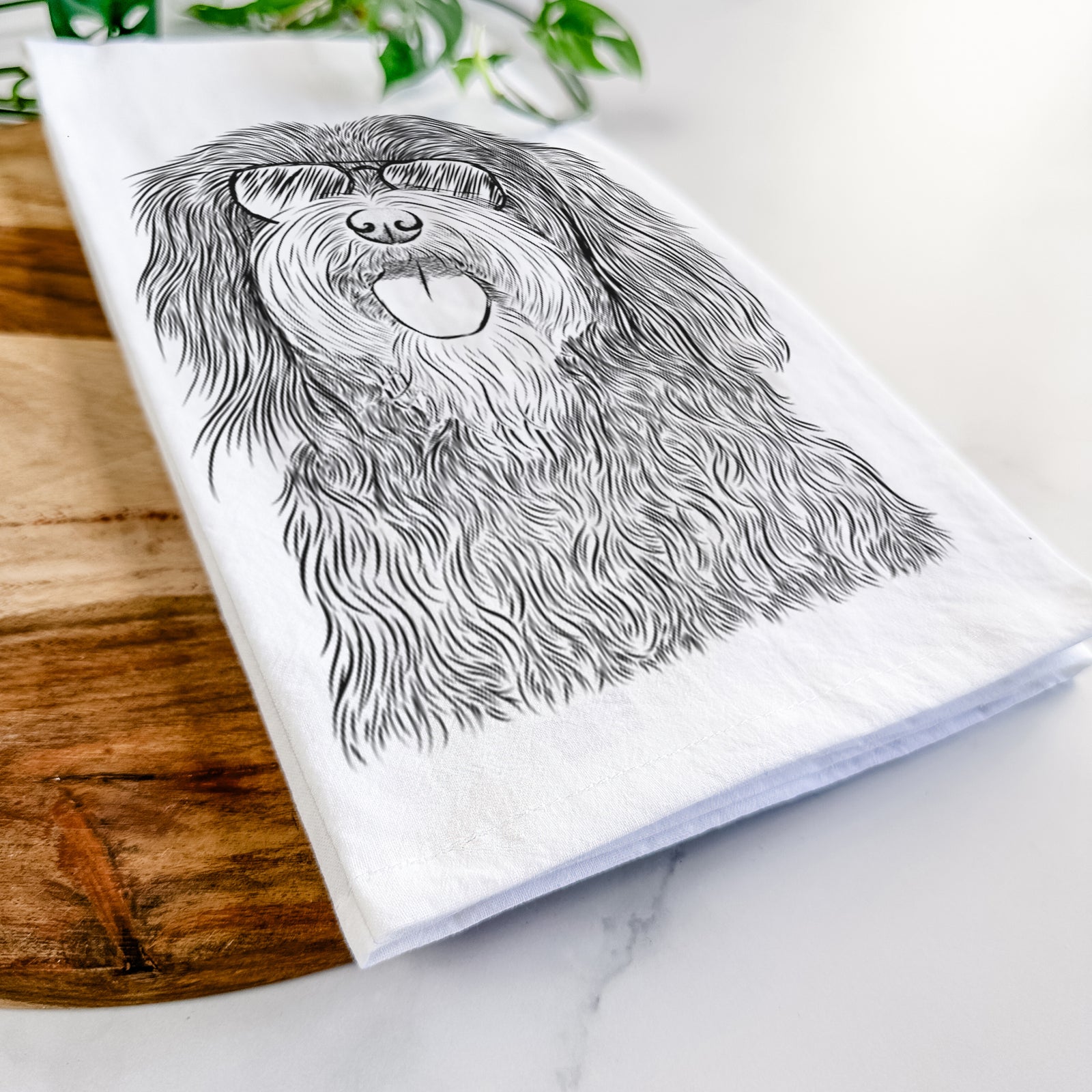 Hand-drawn sketch of Sophie the Havanese wearing aviator sunglasses on a tea towel
