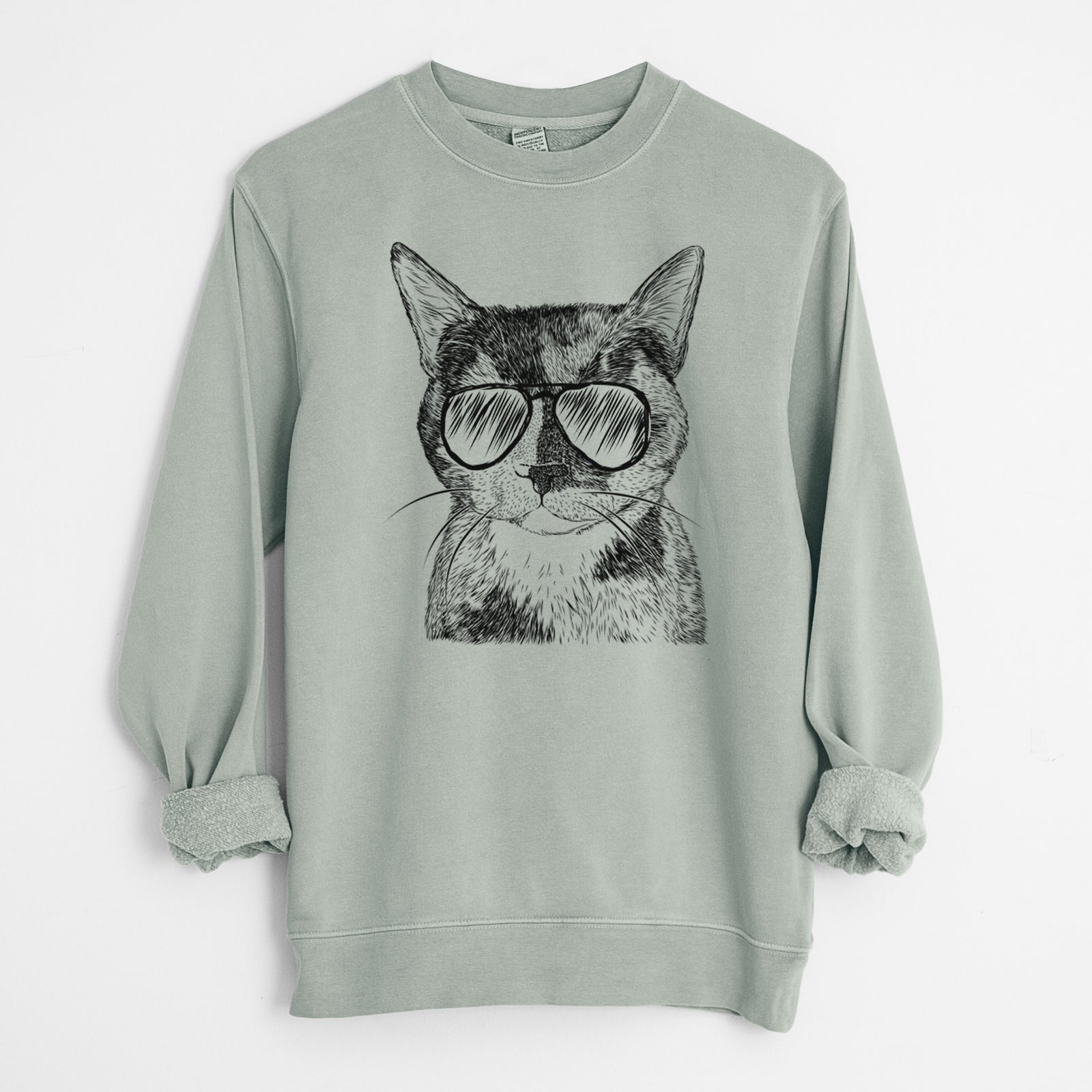 Hand-drawn sketch of Spooky Kitty the Tortoiseshell Cat wearing aviator sunglasses on a Sage Unisex pigment dyed crew sweatshirt