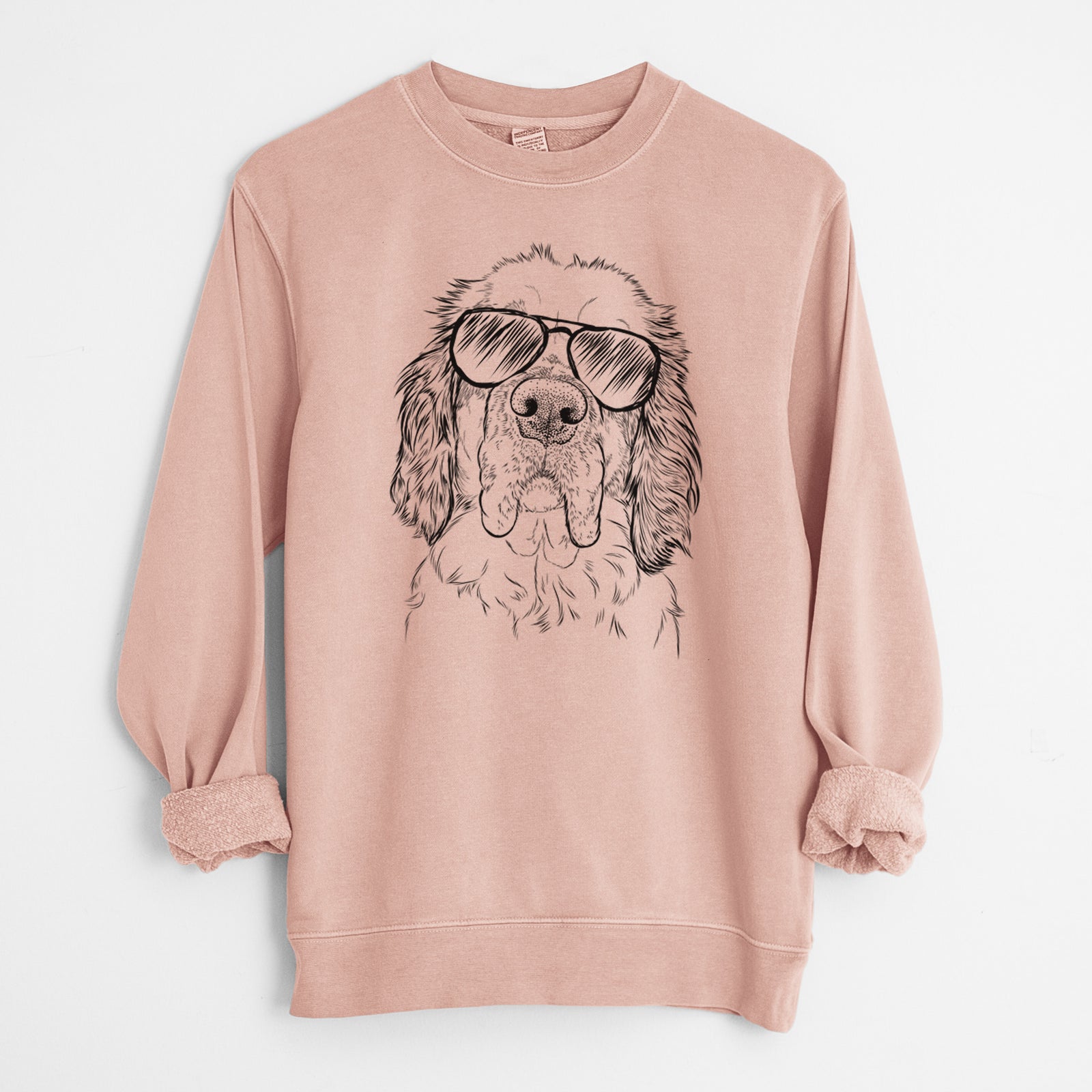 Hand-drawn sketch of Sully the Clumber Spaniel wearing aviator sunglasses on a Dusty Pink Unisex pigment dyed crew sweatshirt
