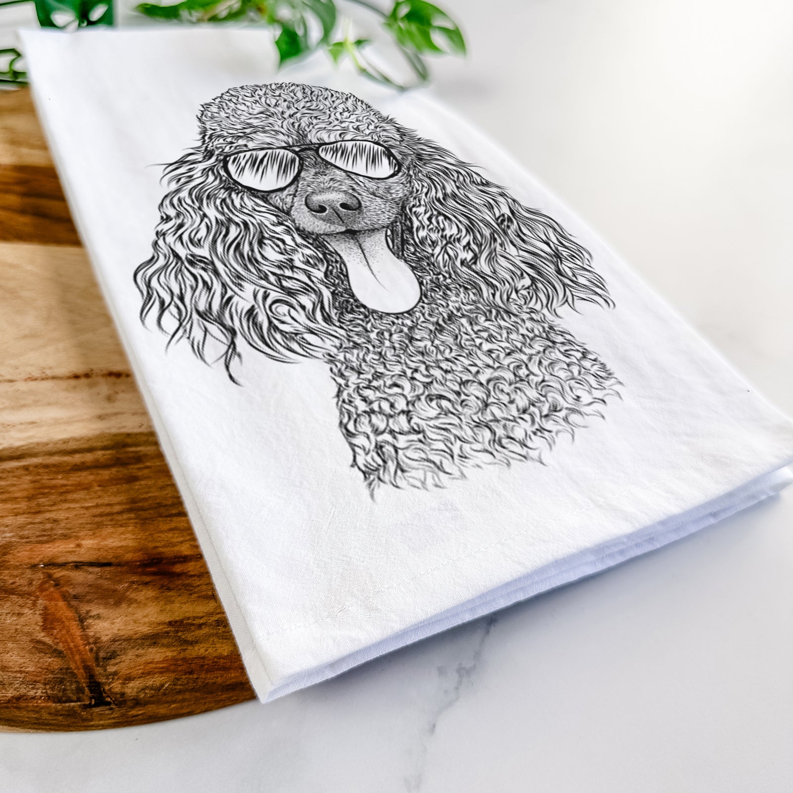 Hand-drawn sketch of Teddy the Mini Poodle wearing aviator sunglasses on a tea towel