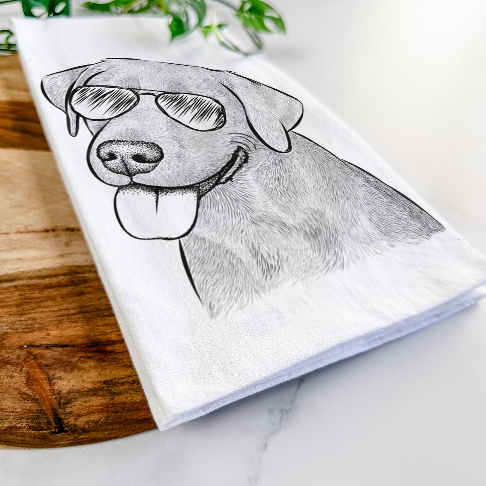 Hand-drawn sketch of Zeppelin the Black Labrador wearing aviator sunglasses on a tea towel