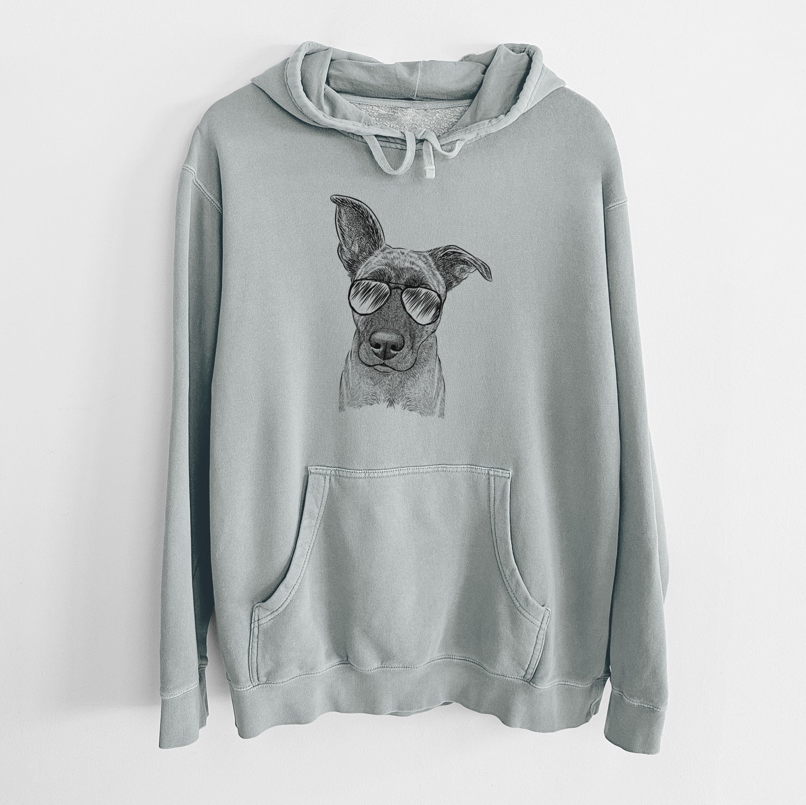 Hand-drawn sketch of Zoey the Mixed Breed wearing aviator sunglasses on a Sage Unisex pigment dyed hoodie