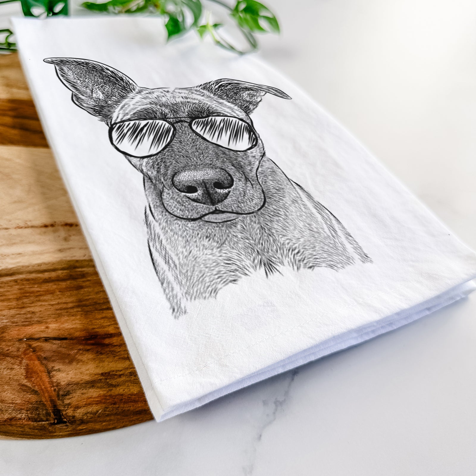 Hand-drawn sketch of Zoey the Mixed Breed wearing aviator sunglasses on a tea towel