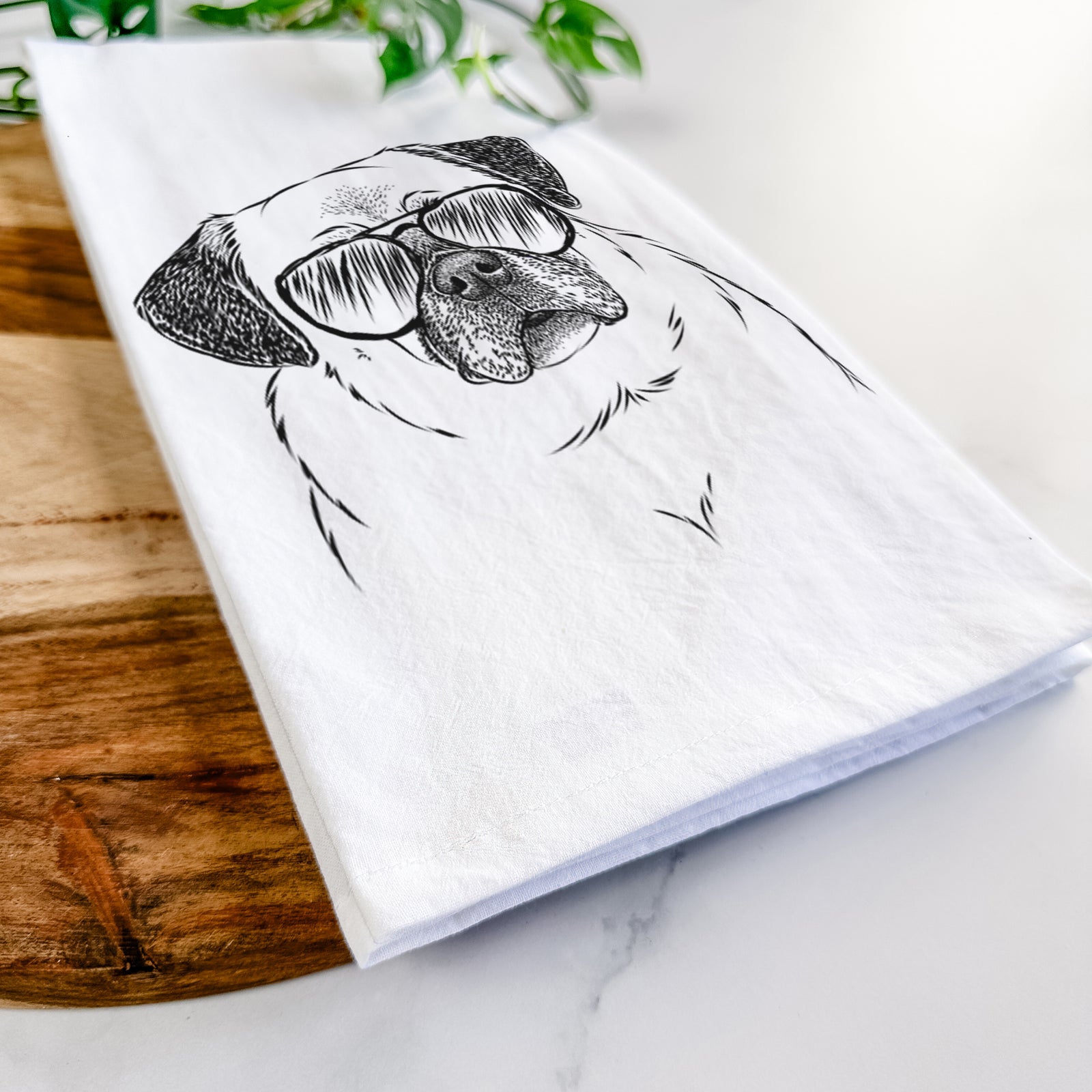Hand-drawn sketch of Zoey the Pug wearing aviator sunglasses on a tea towel