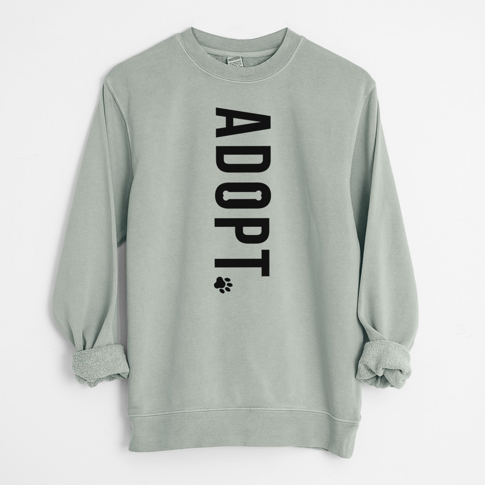'Adopt' design on a Sage Unisex pigment dyed crew sweatshirt