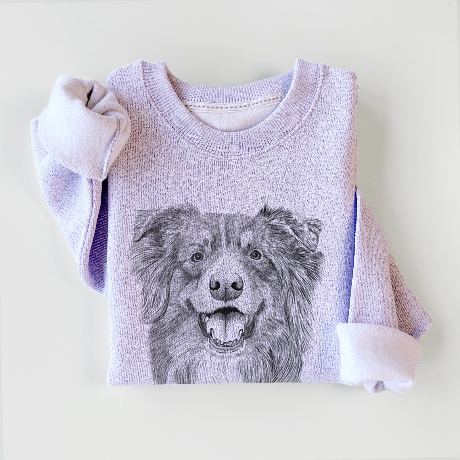 Hand-drawn sketch of Aussie Parker the Australian Shepherd on an Ice Purple knit sweatshirt