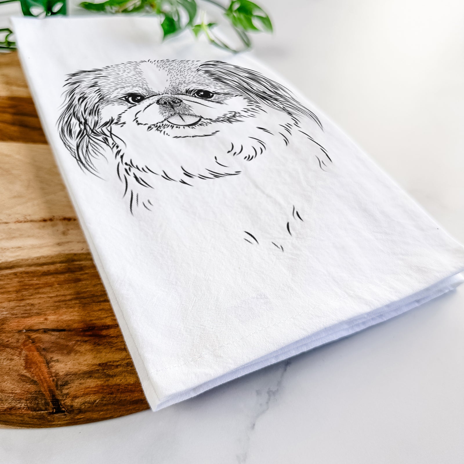 Hand-drawn sketch of Abra Bean the Pekingese on a tea towel