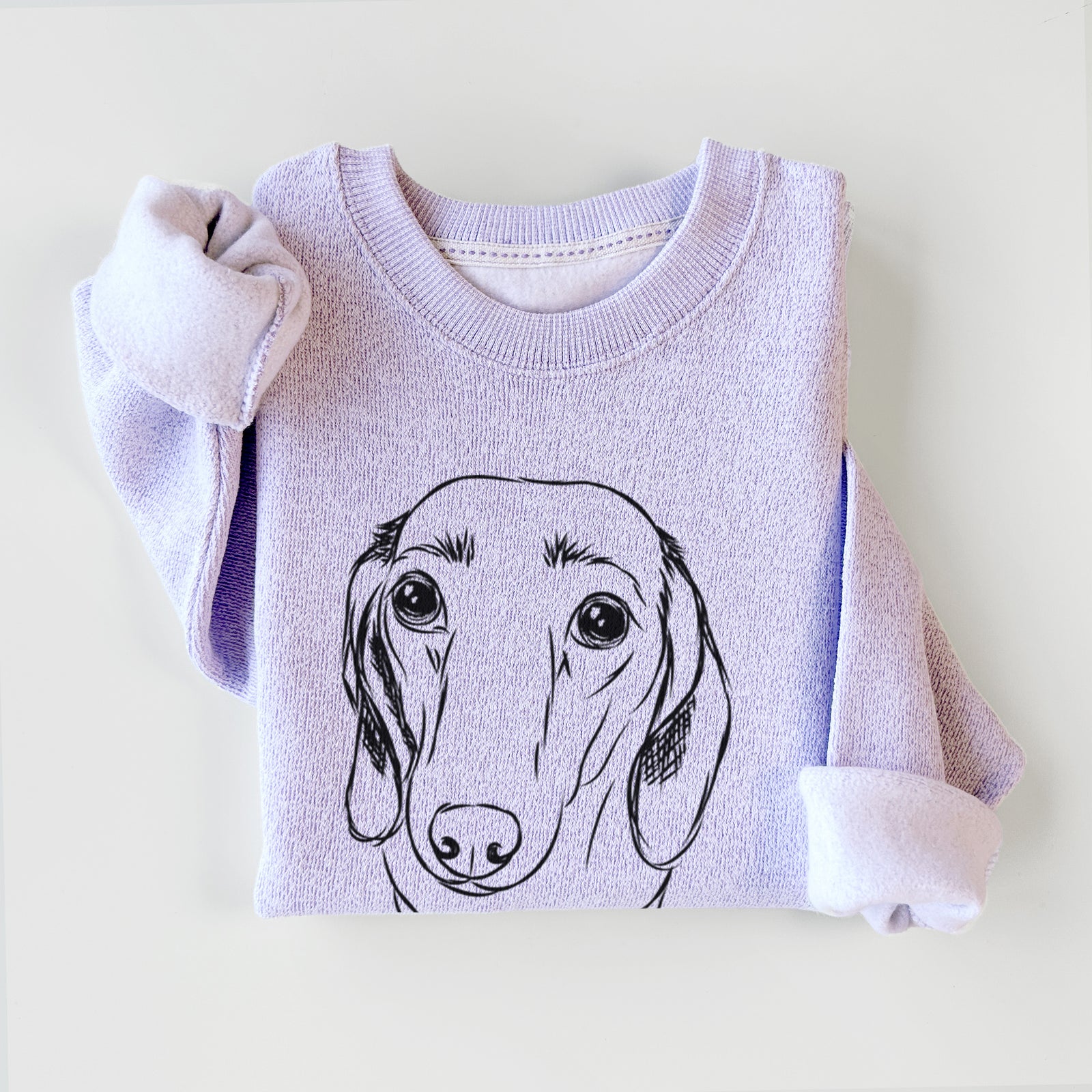 Hand-drawn sketch of Annabelle the Dachshund on an Ice Purple knit sweatshirt