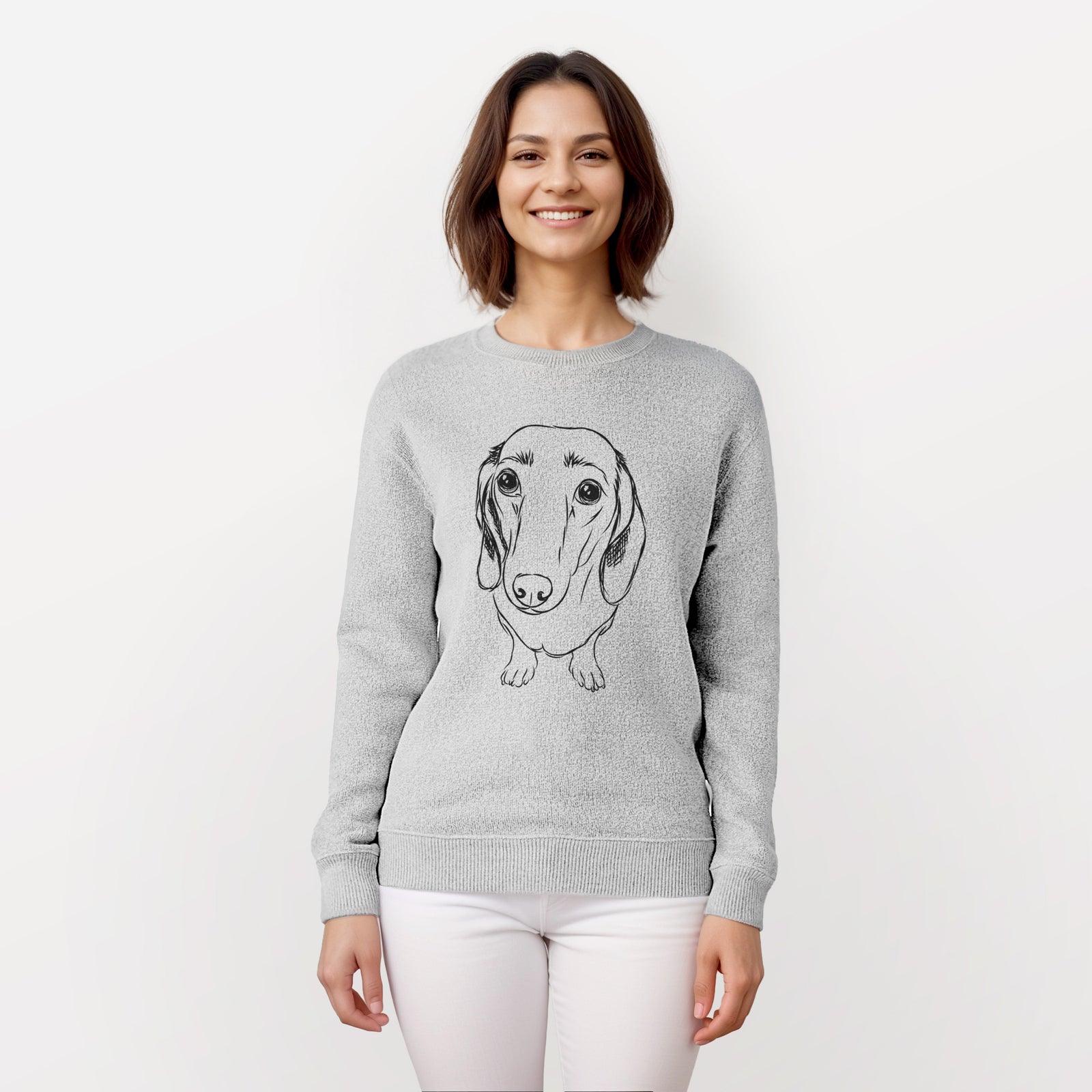 Hand-drawn sketch of Annabelle the Dachshund on a knit sweatshirt, worn by a woman