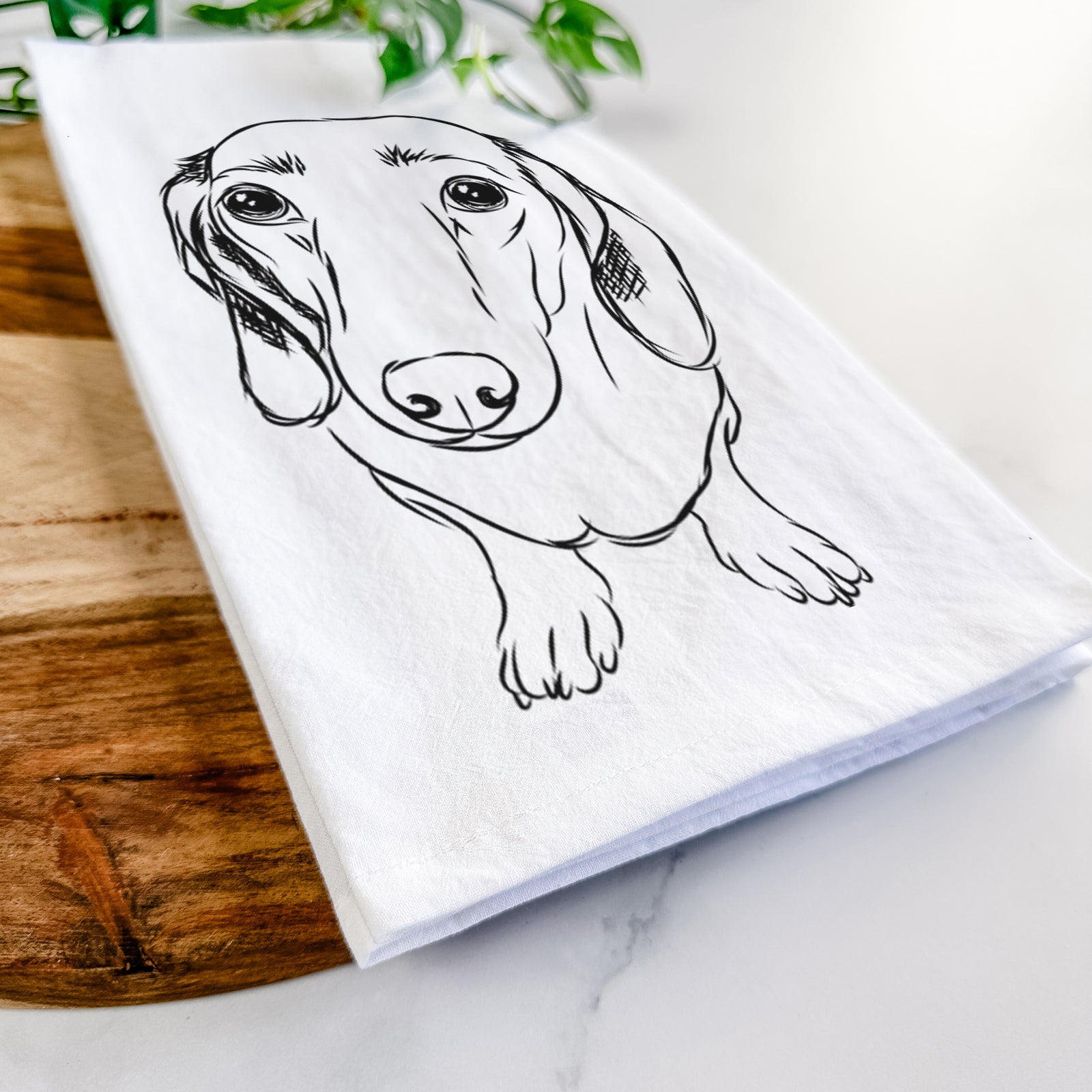 Hand-drawn sketch of Annabelle the Dachshund on a tea towel