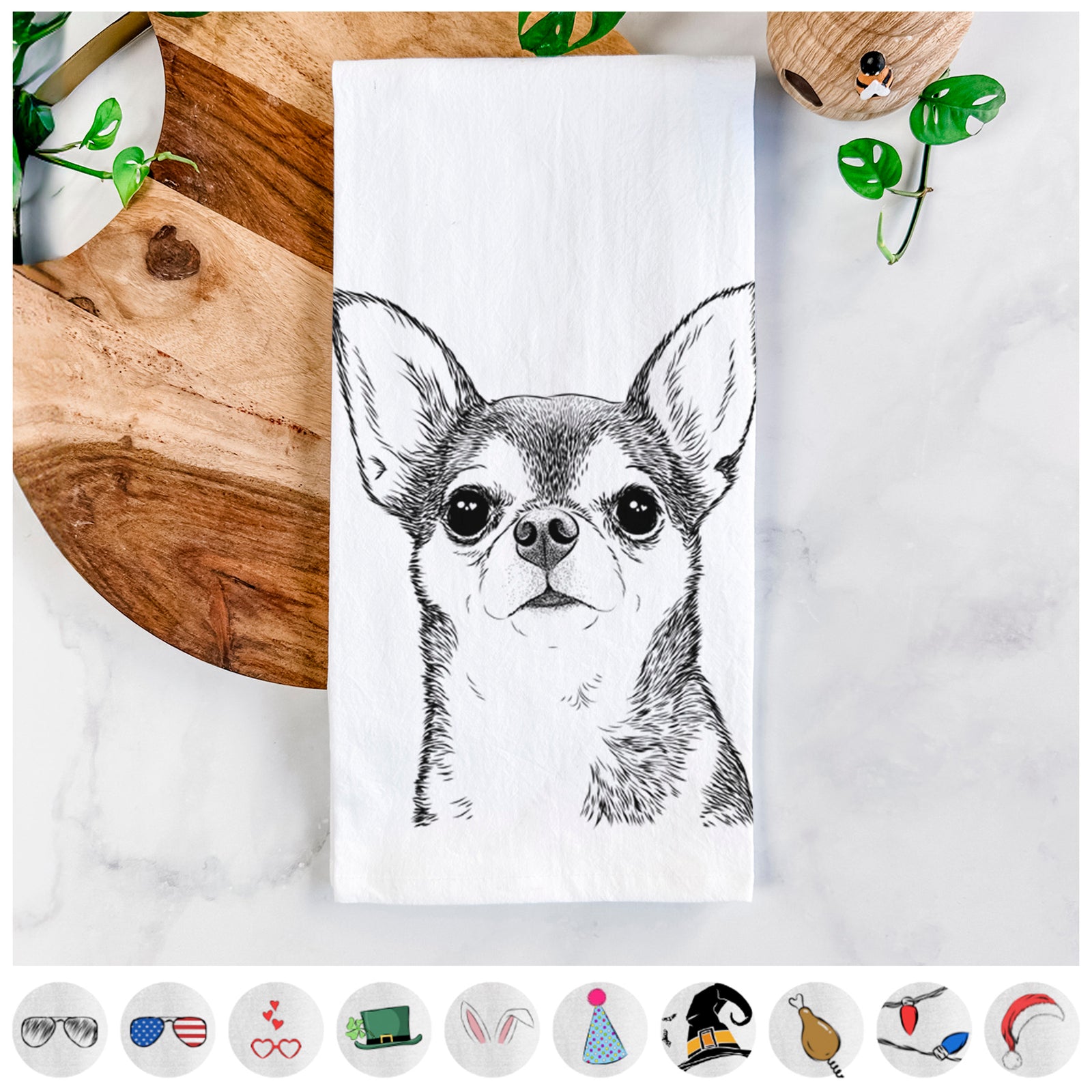Hand-drawn sketch of Baby the Chihuahua on a tea towel, shown with icons of the other available costume styles