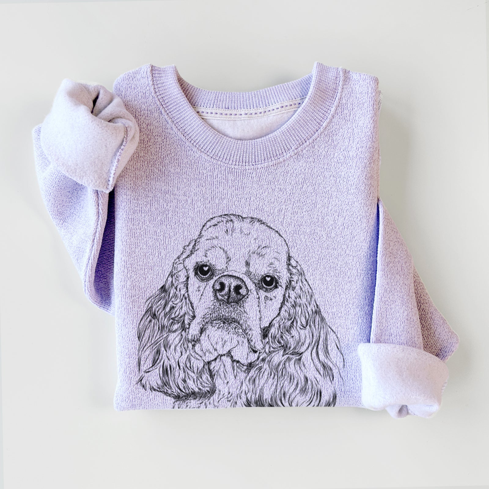 Hand-drawn sketch of Bailey the American Cocker Spaniel on an Ice Purple knit sweatshirt
