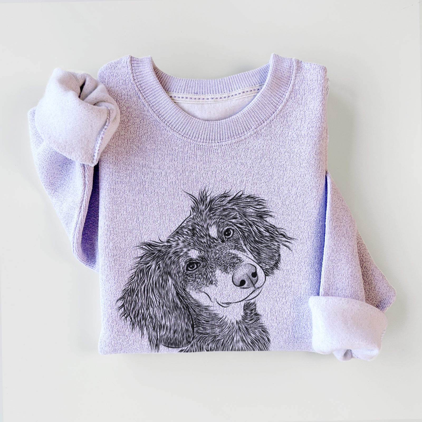 Hand-drawn sketch of Bailey the Long Haired Dachshund on an Ice Purple knit sweatshirt