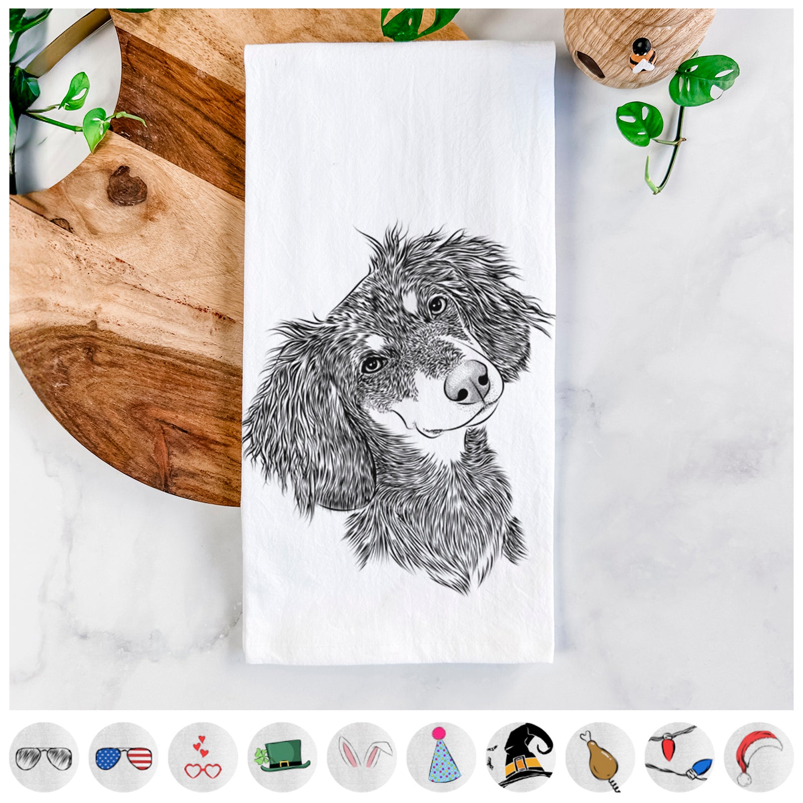 Hand-drawn sketch of Bailey the Long Haired Dachshund on a tea towel, shown with icons of the other available costume styles