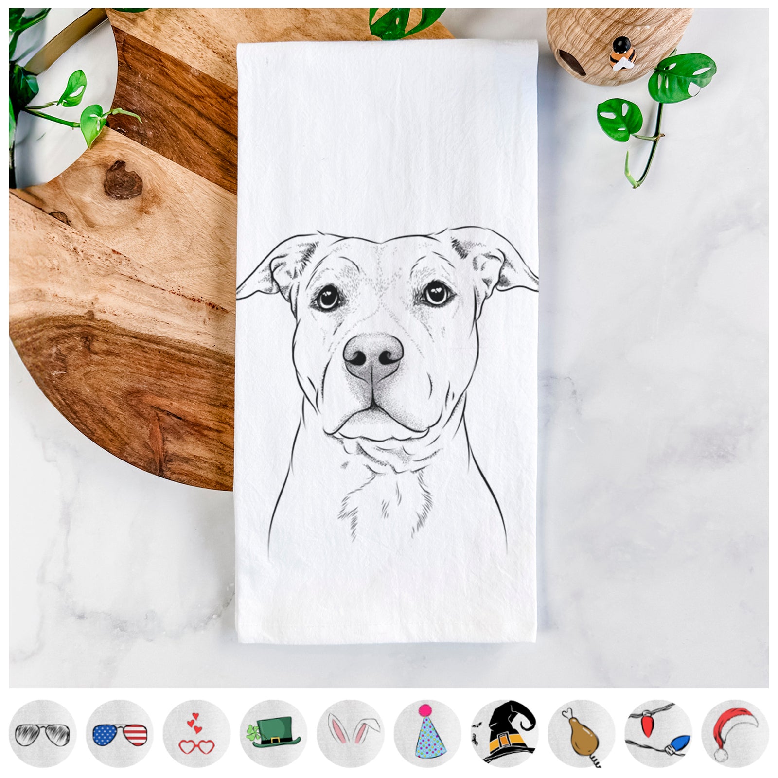 Hand-drawn sketch of Bailey the American Staffordshire Terrier on a tea towel, shown with icons of the other available costume styles