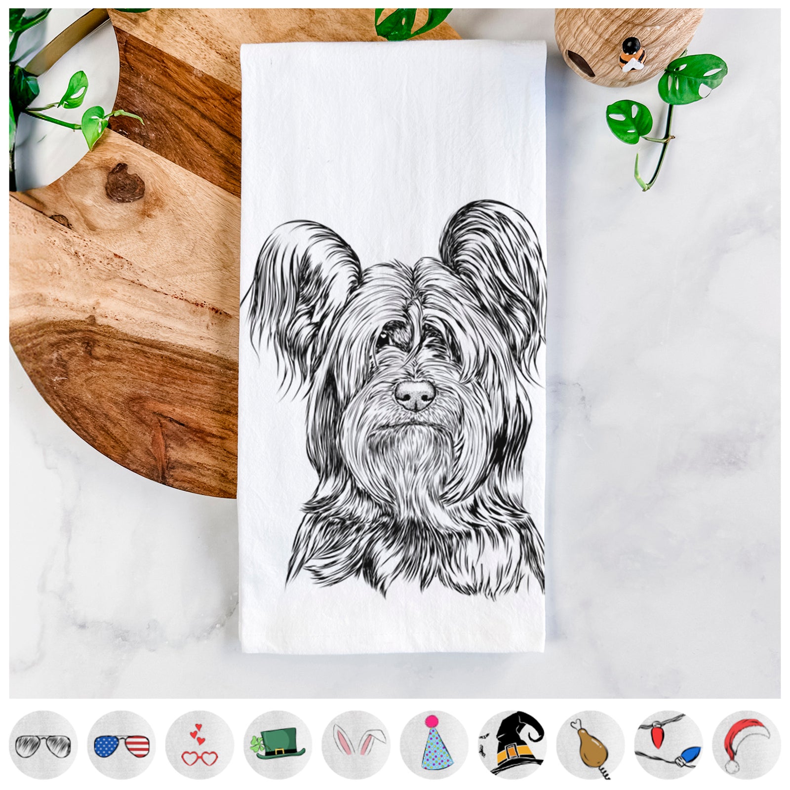 Hand-drawn sketch of Bandit the Skye Terrier on a tea towel, shown with icons of the other available costume styles