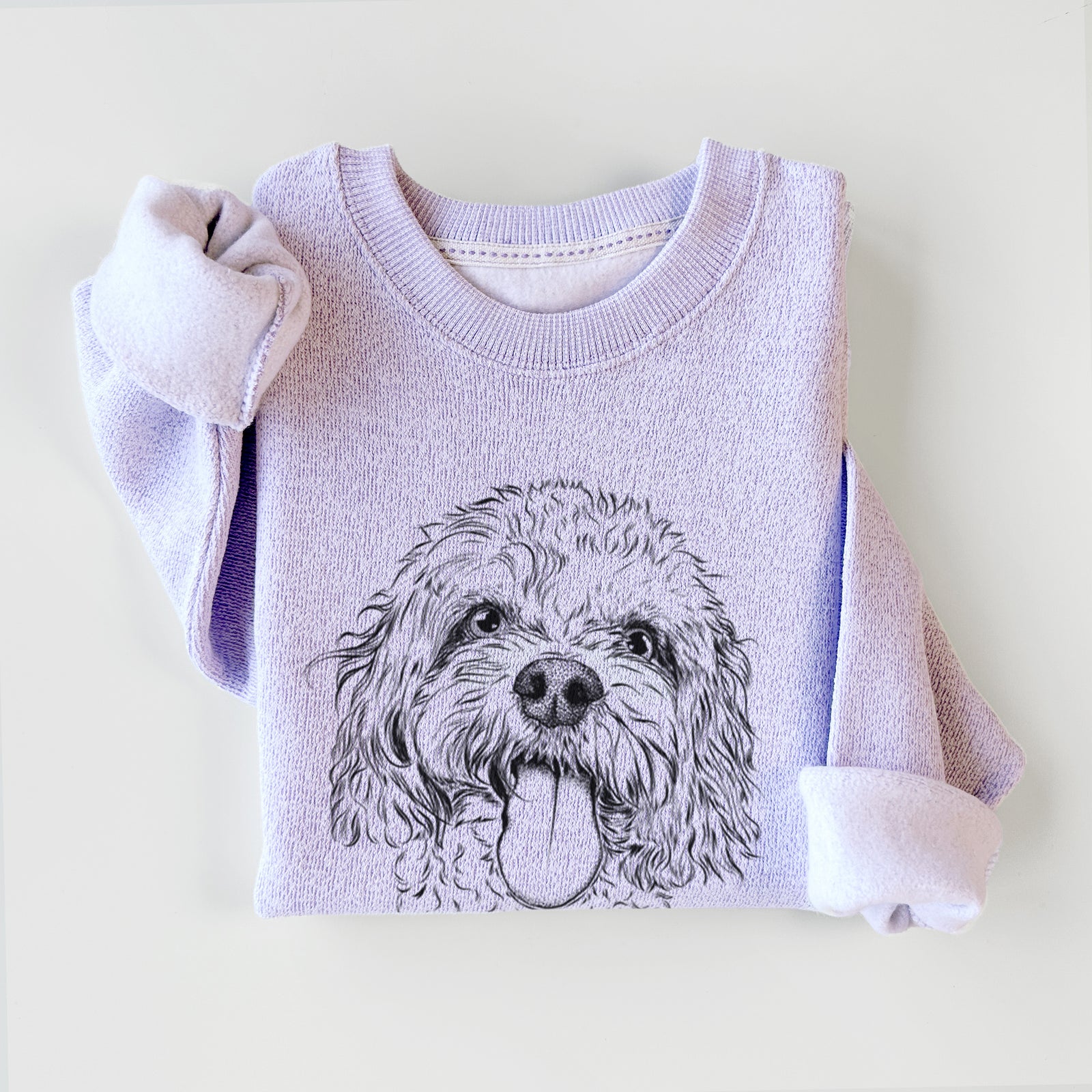 Hand-drawn sketch of Barney the Cavachon on an Ice Purple knit sweatshirt