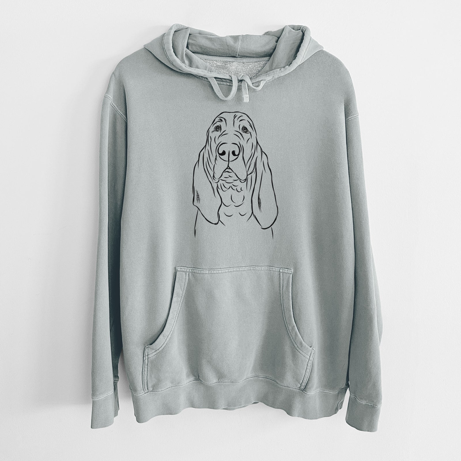 Hand-drawn sketch of Baron the Bloodhound on a Sage Unisex pigment dyed hoodie