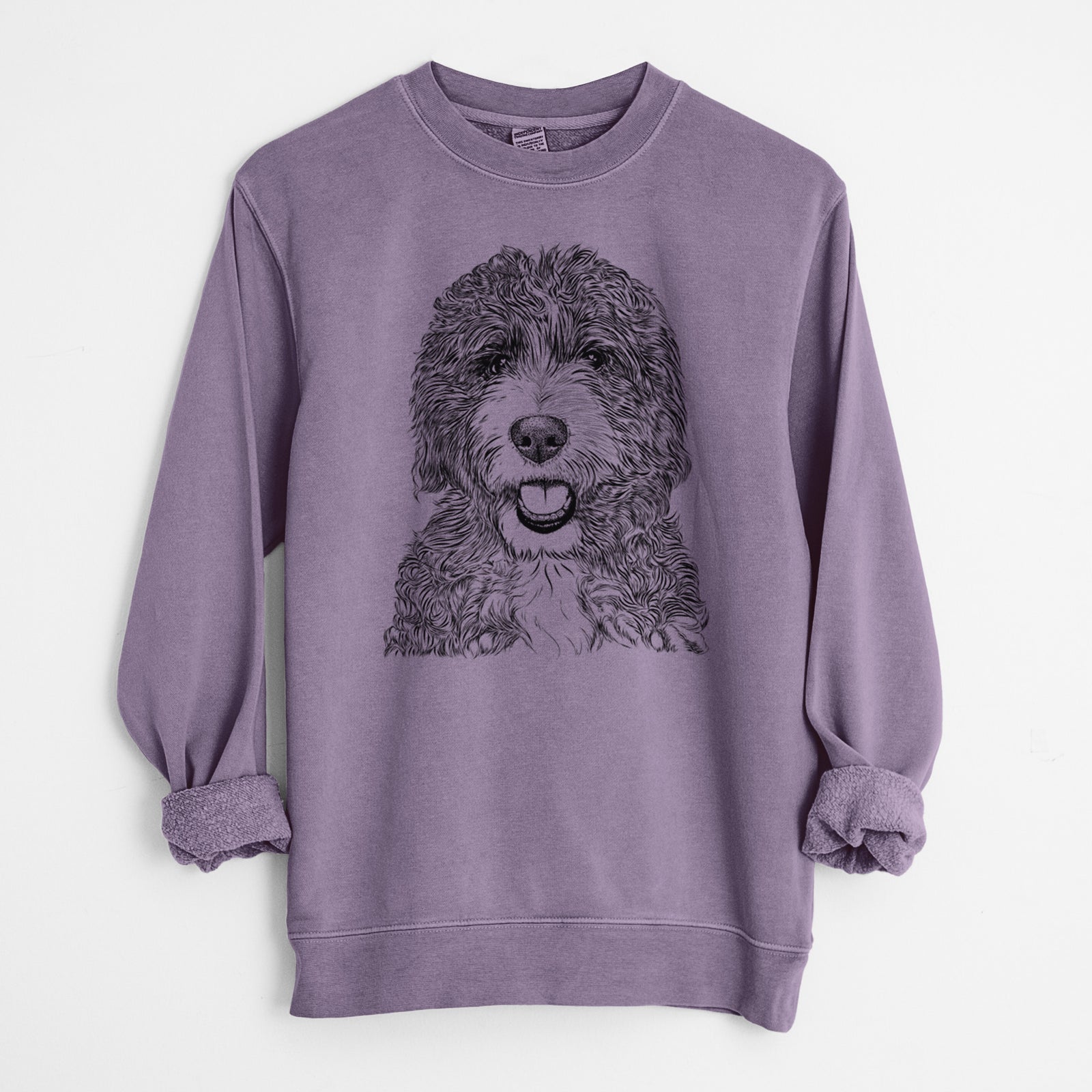Hand-drawn sketch of Bash the Bernedoodle on a Plum Unisex pigment dyed crew sweatshirt