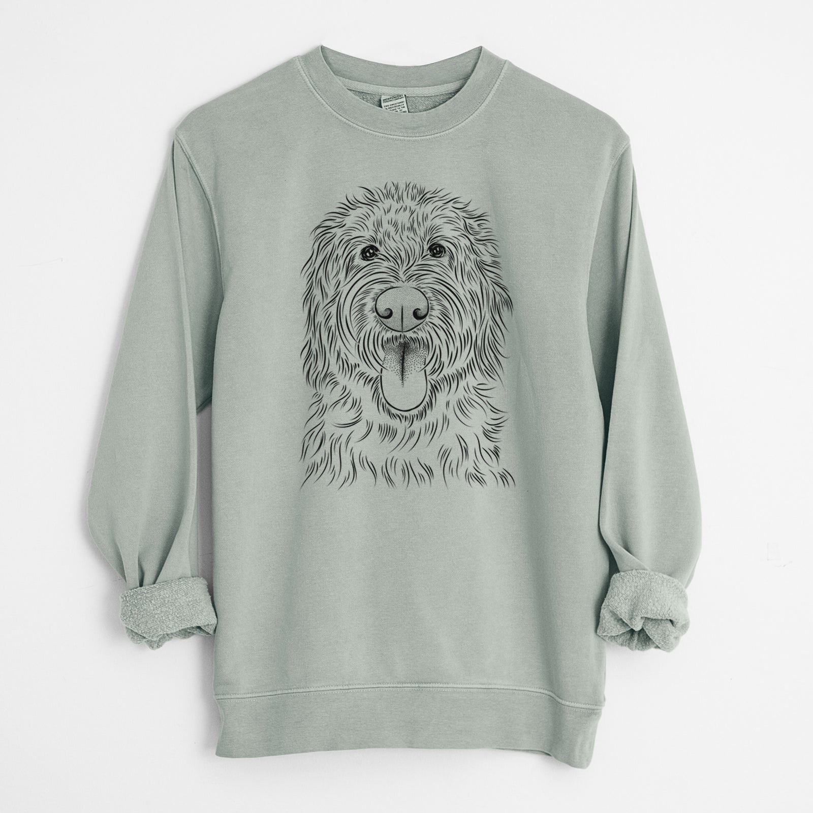 Hand-drawn sketch of Bennett the Doodle on a Sage Unisex pigment dyed crew sweatshirt