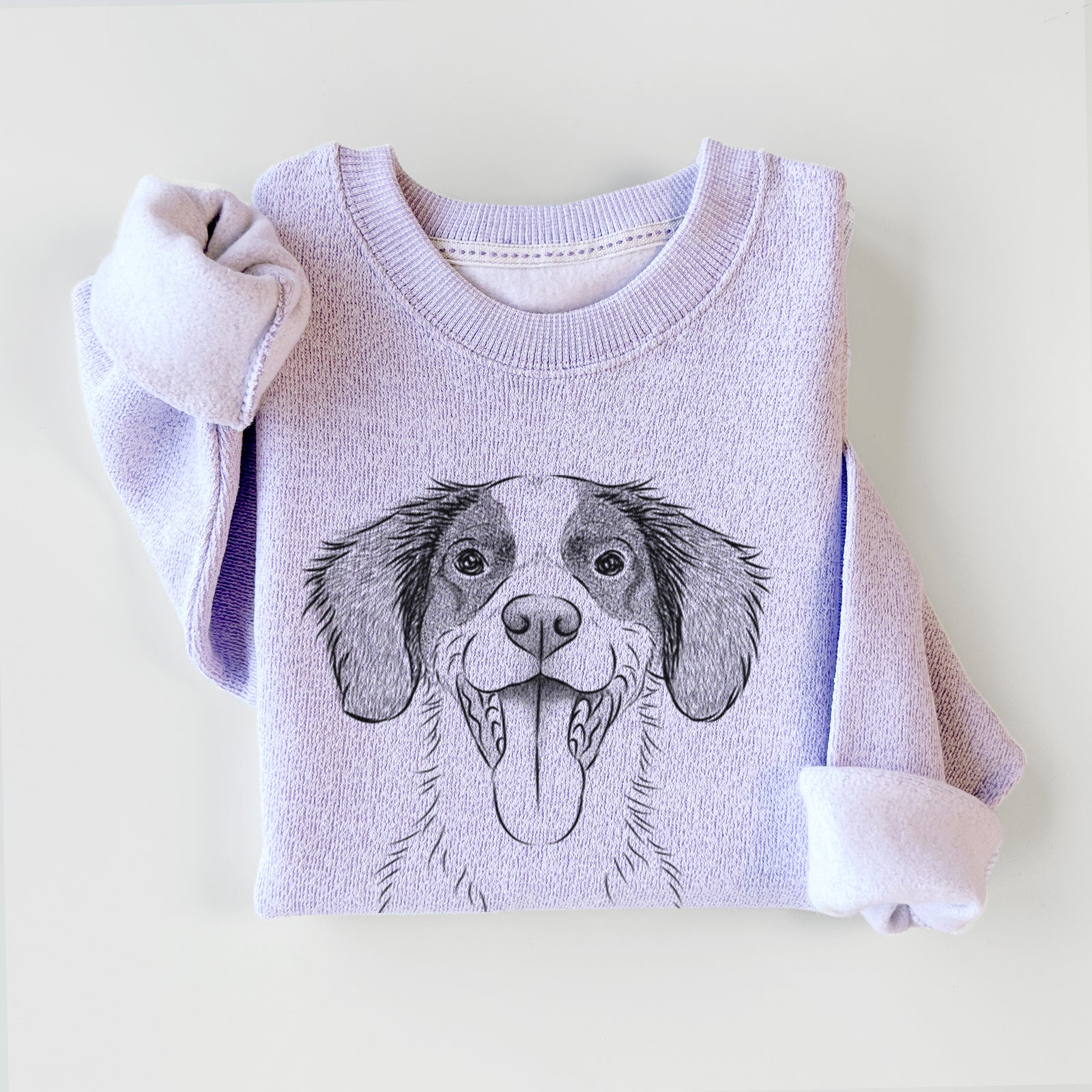 Hand-drawn sketch of Birdie the Brittany on an Ice Purple knit sweatshirt