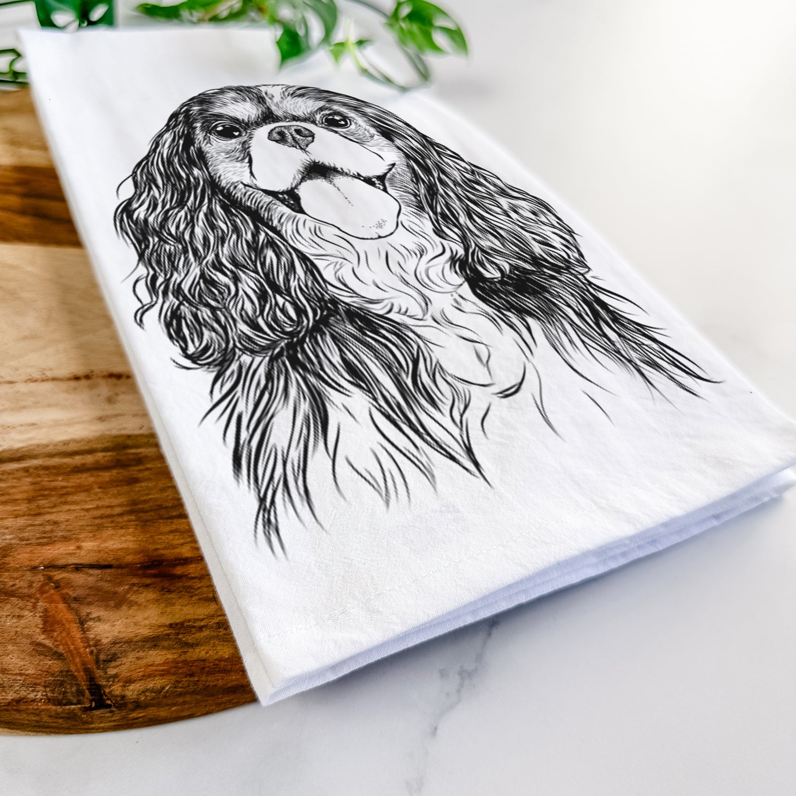 Hand-drawn sketch of Brandy the Cavalier King Charles Spaniel on a tea towel