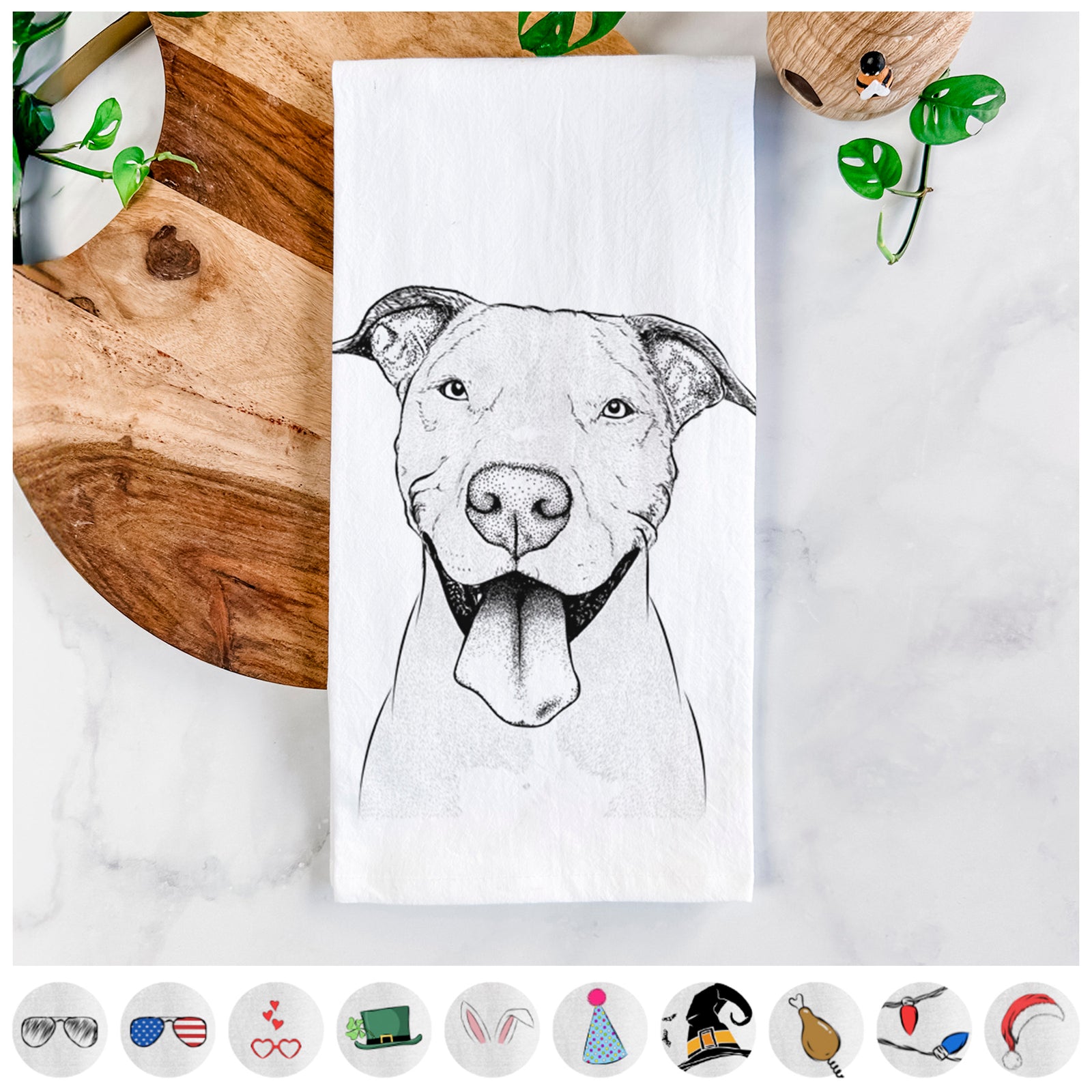 Hand-drawn sketch of Bruce the American Staffordshire Terrier on a tea towel, shown with icons of the other available costume styles