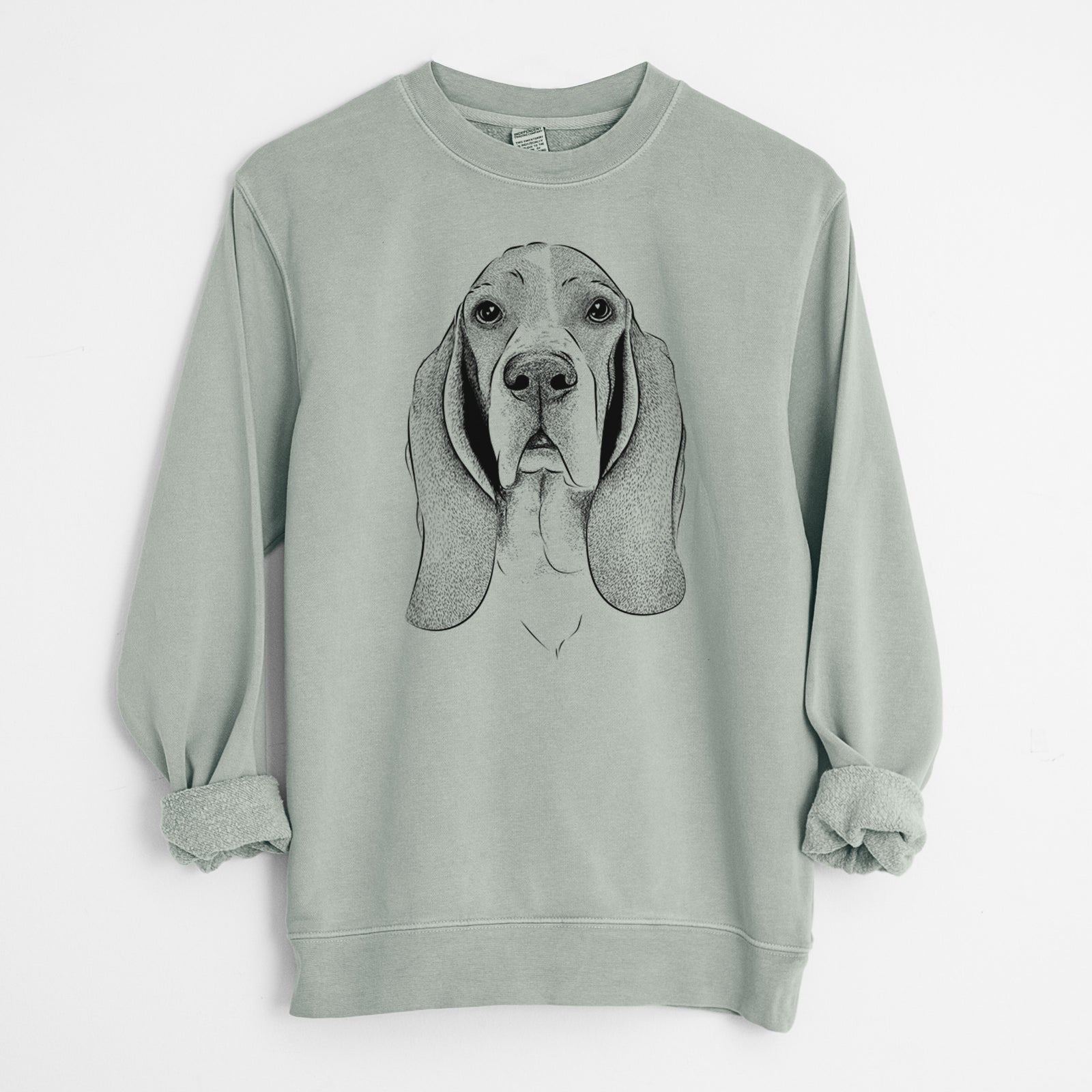 Hand-drawn sketch of Buckley the Basset Hound on a Sage Unisex pigment dyed crew sweatshirt