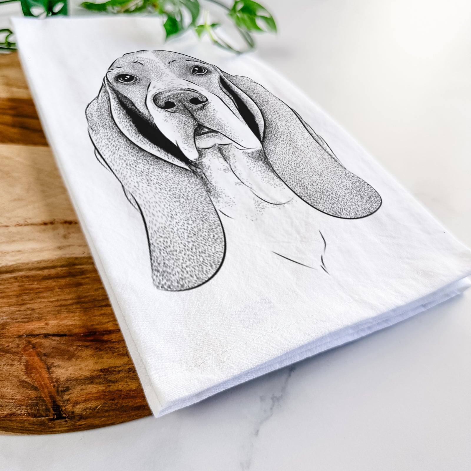 Hand-drawn sketch of Buckley the Basset Hound on a tea towel